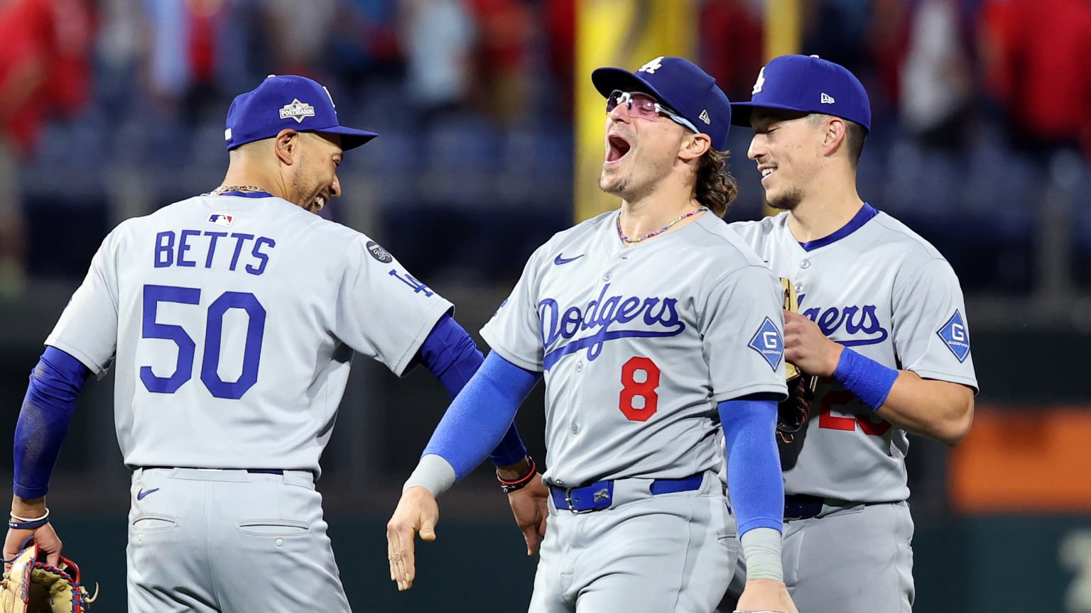 Kiké Hernández celebrates after a game with Mookie Betts and Tommy Edman