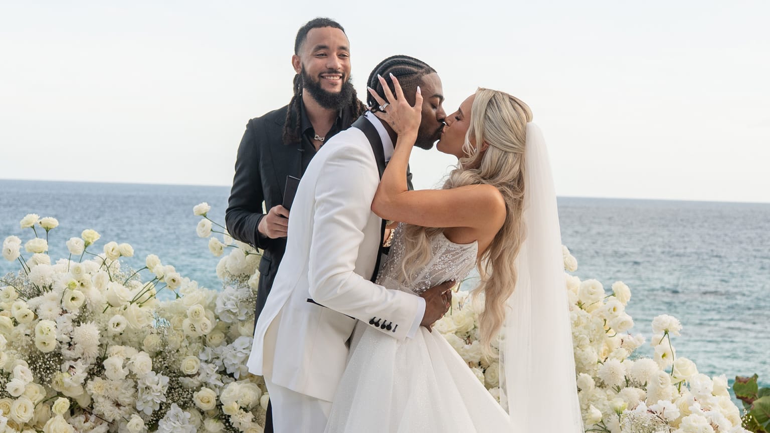 Mariners shortstop J.P. Crawford looks on as Ryan and Katelynn Bliss share a kiss at their wedding Mariners shortstop J.P. Crawford looks on as Ryan and Katelynn Bliss share a kiss at their wedding