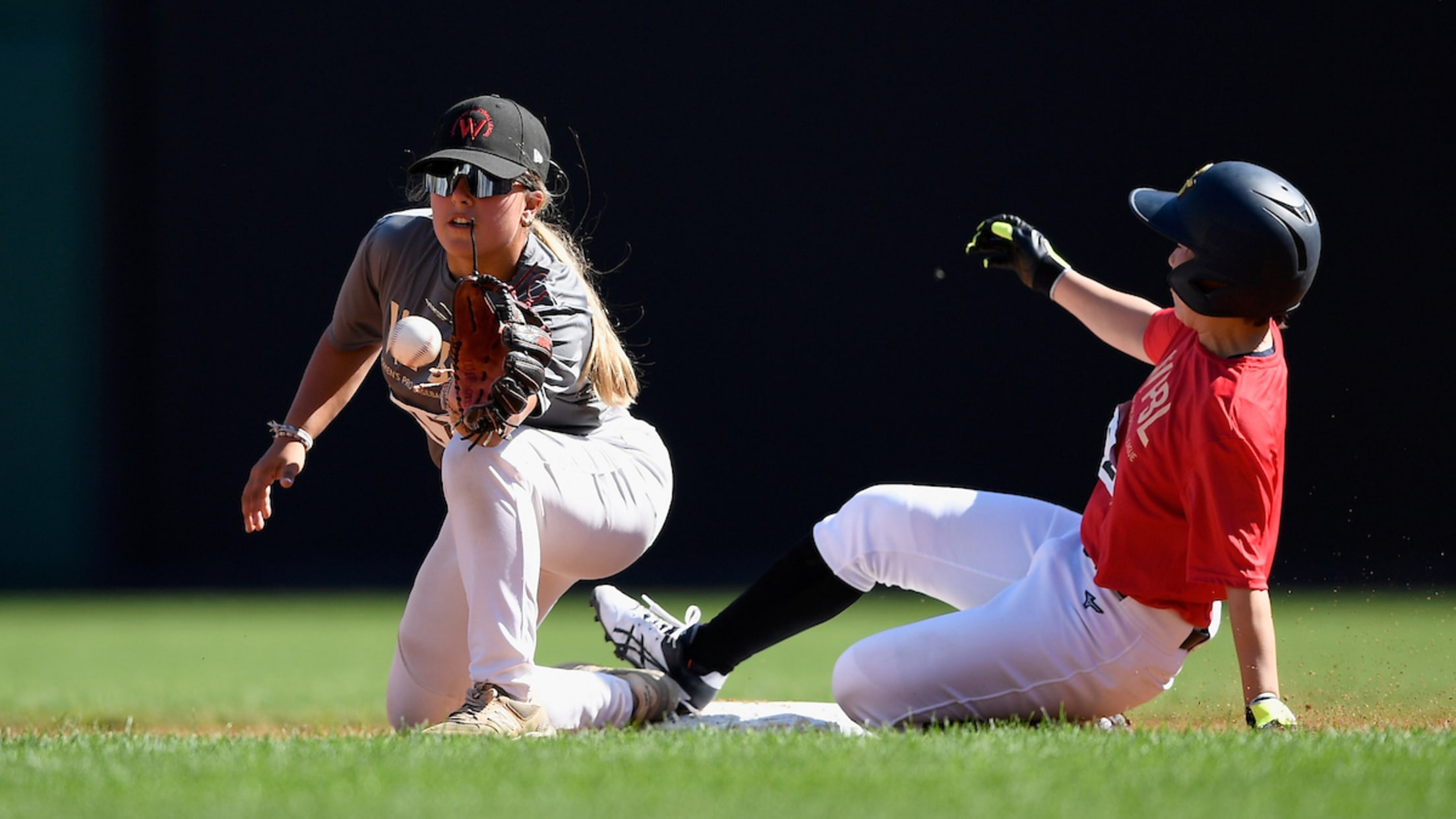 A play at second base in the Women's Pro Baseball League tryouts