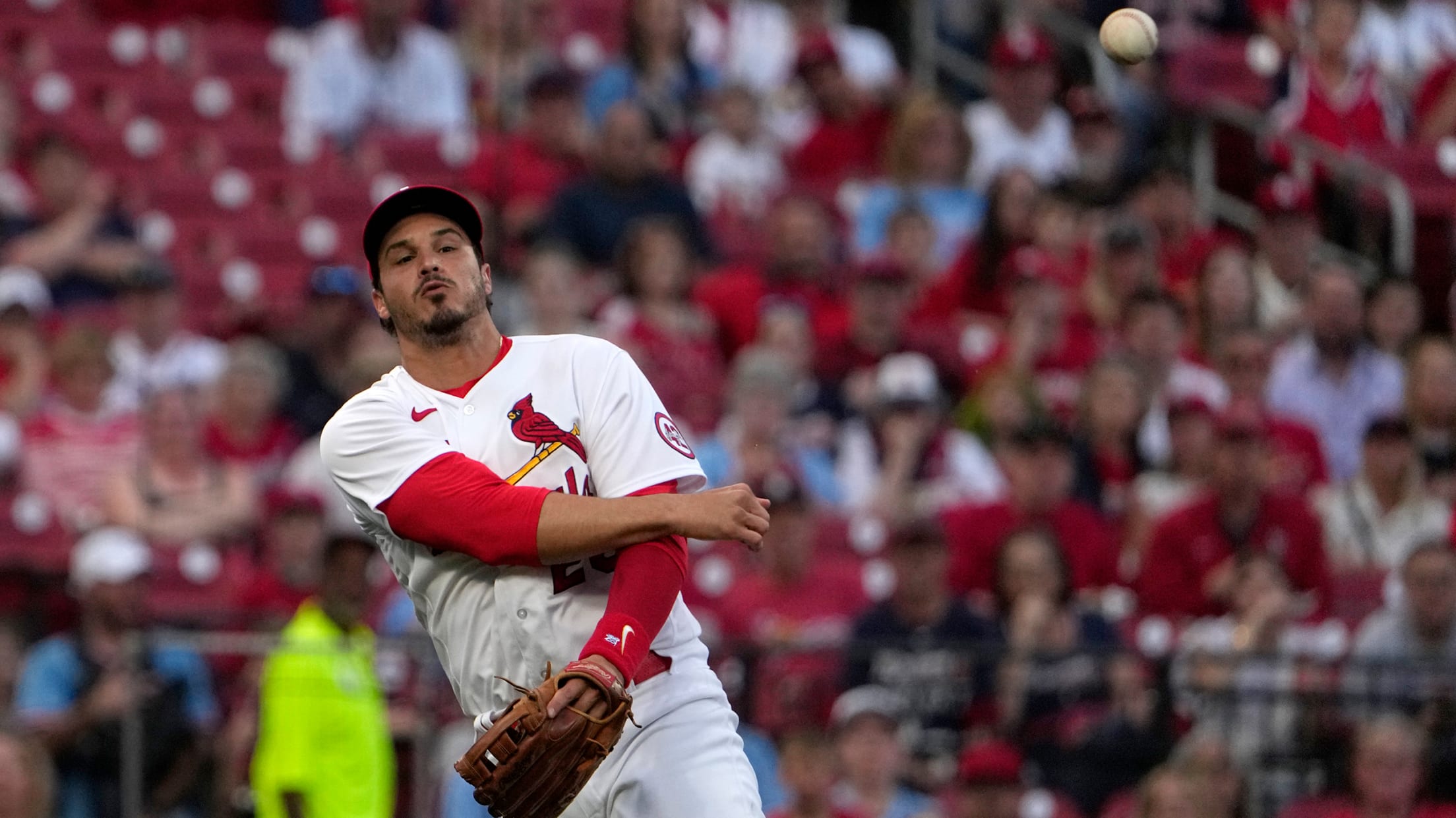 Nolan Arenado makes an off-balance throw