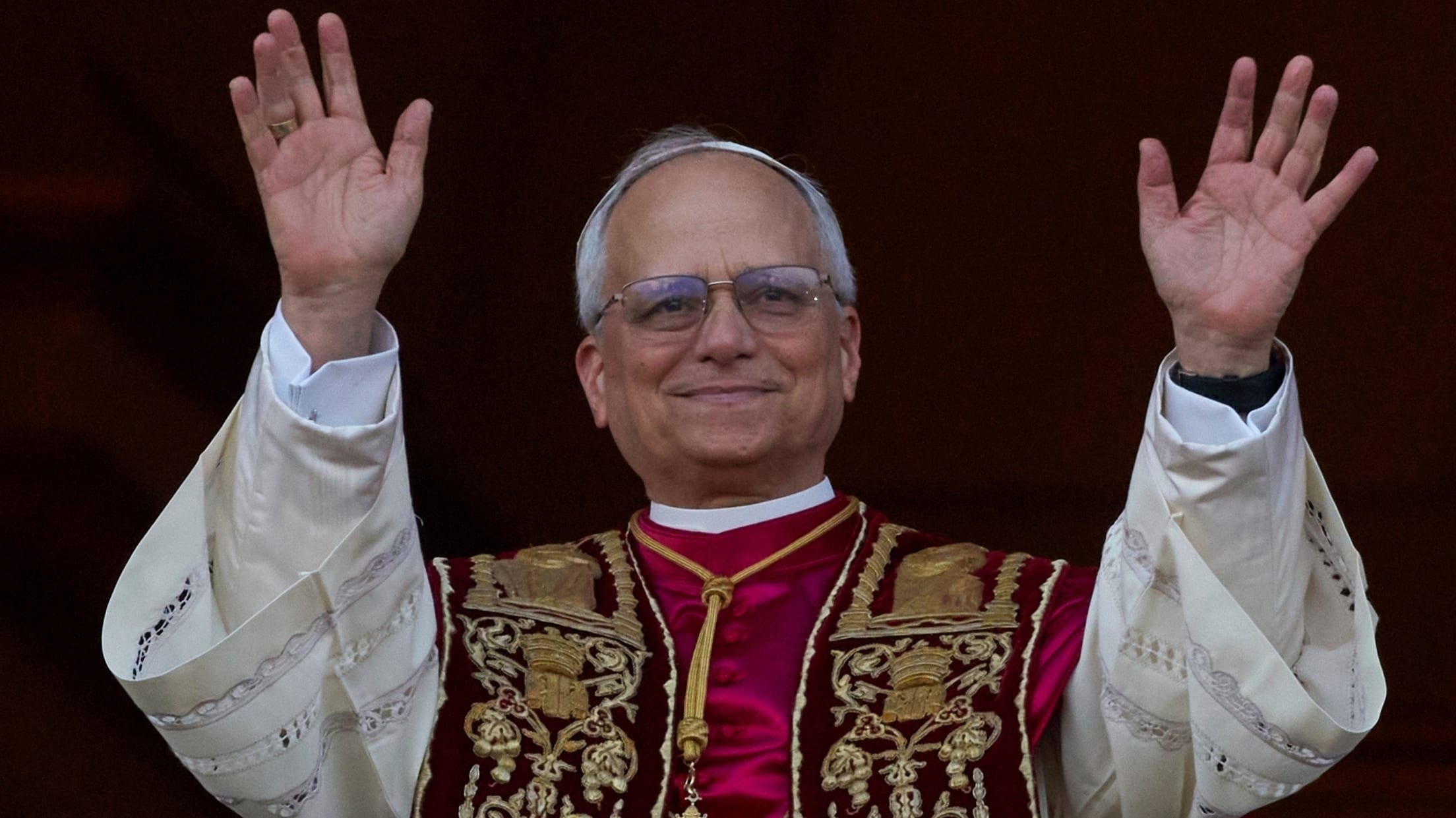 Pope Leo XIV waves with both hands