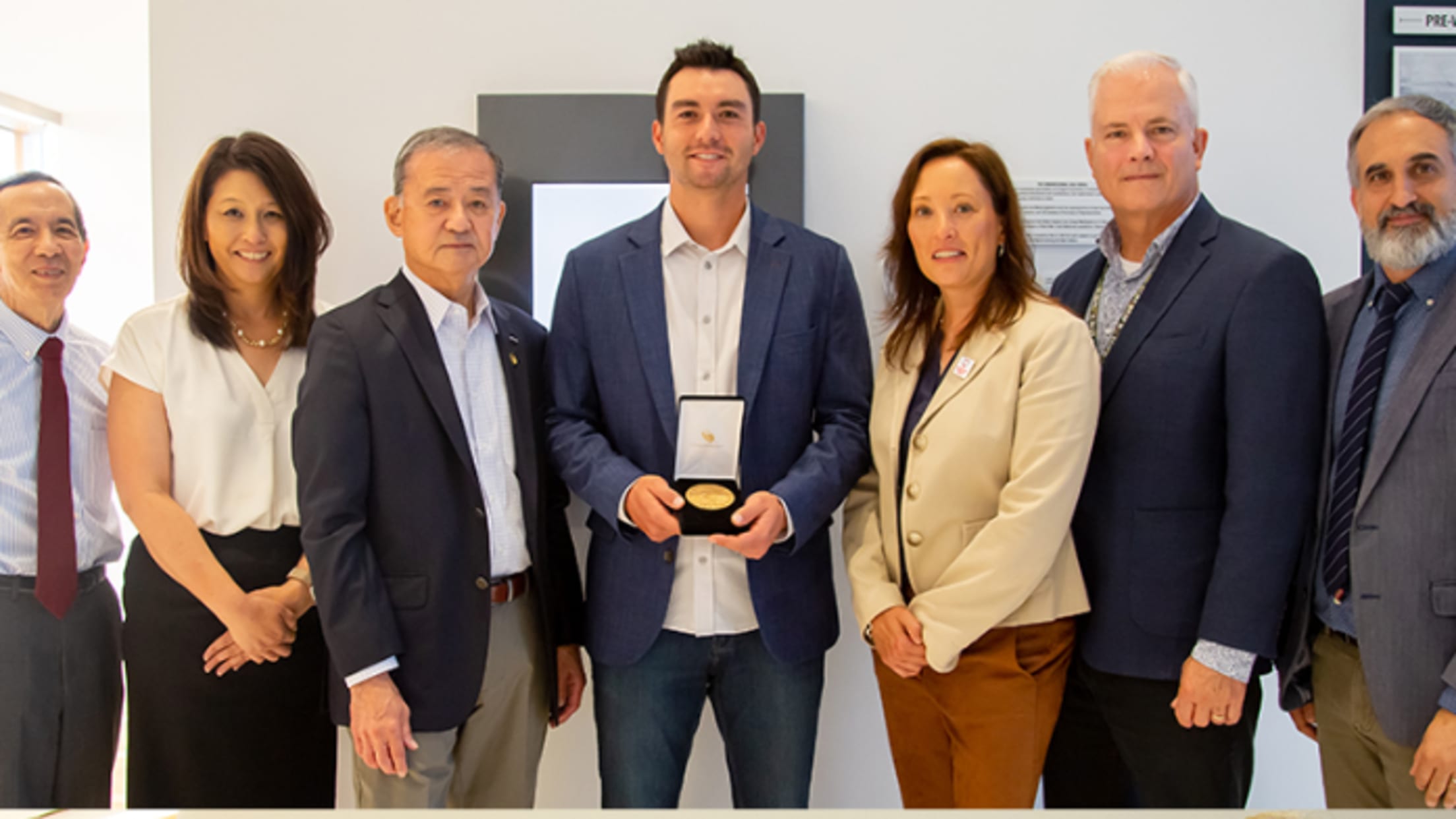 Kyle Higashioka holds a replica Congressional Gold Medal at the U.S. Army Museum