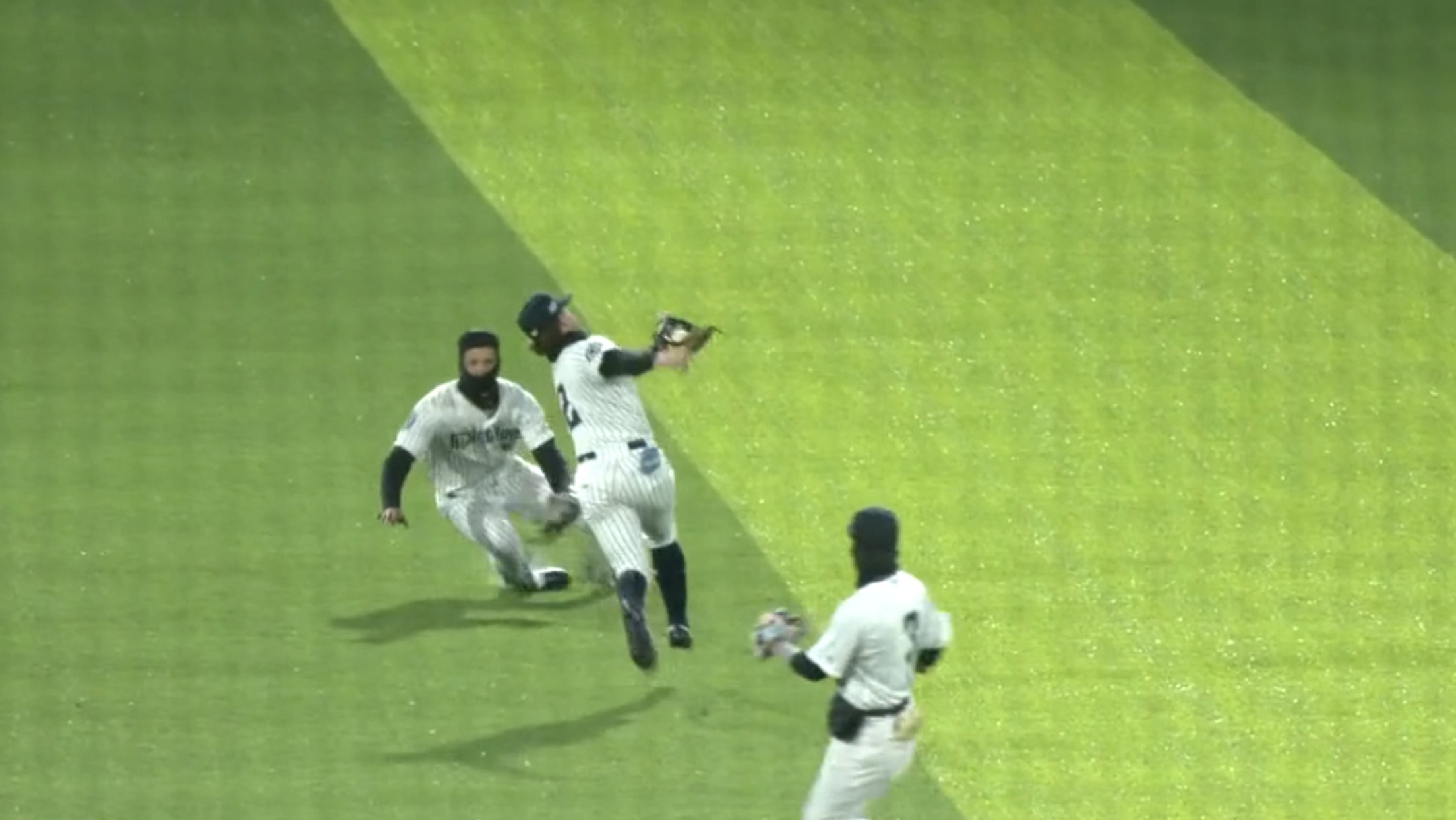 Yankees prospect Roc Riggio makes an over-the-shoulder catch before tripping over a diving teammate
