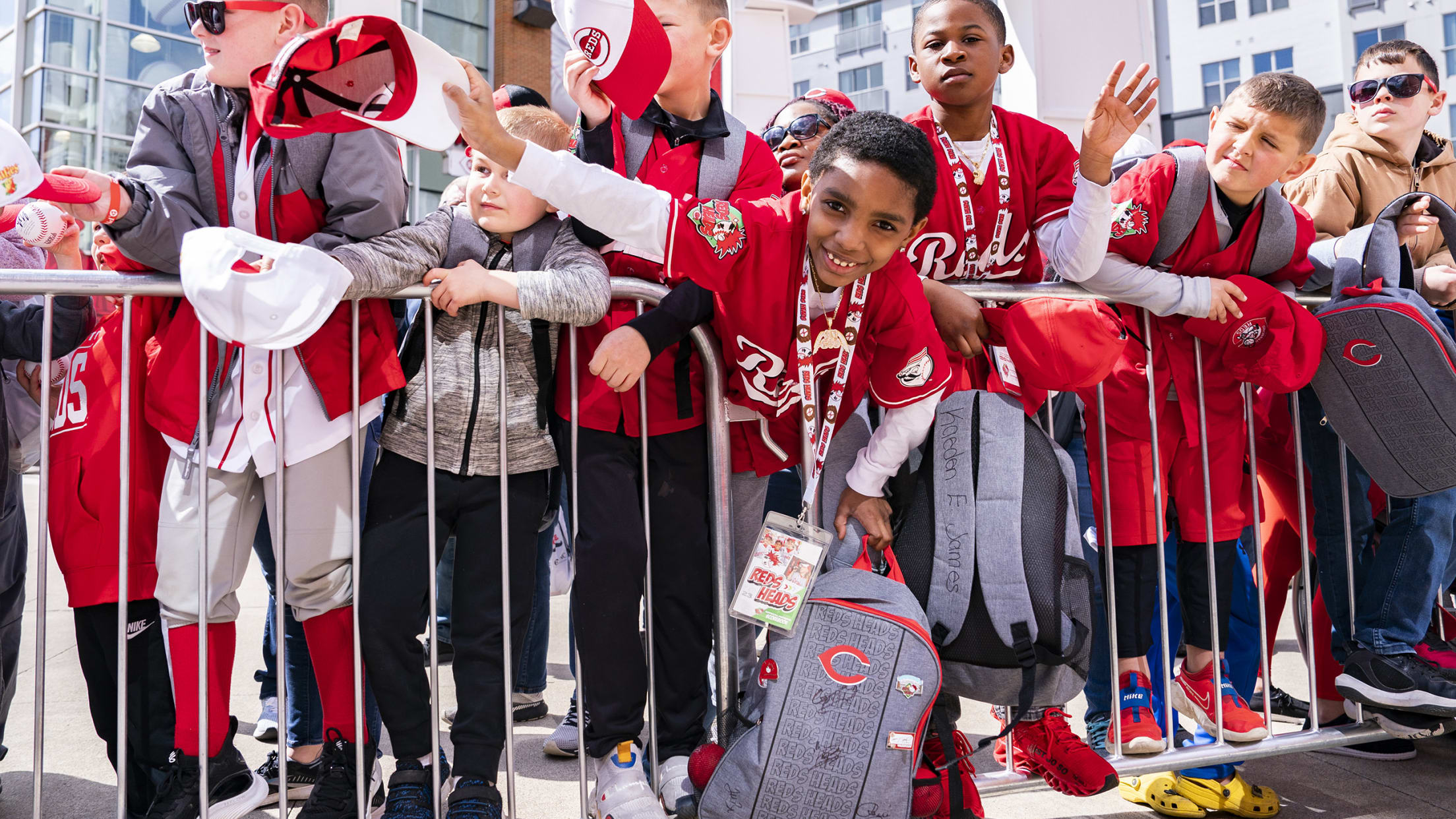 Reds players, kids celebrate Fiesta Rojos at Reds Youth Academy