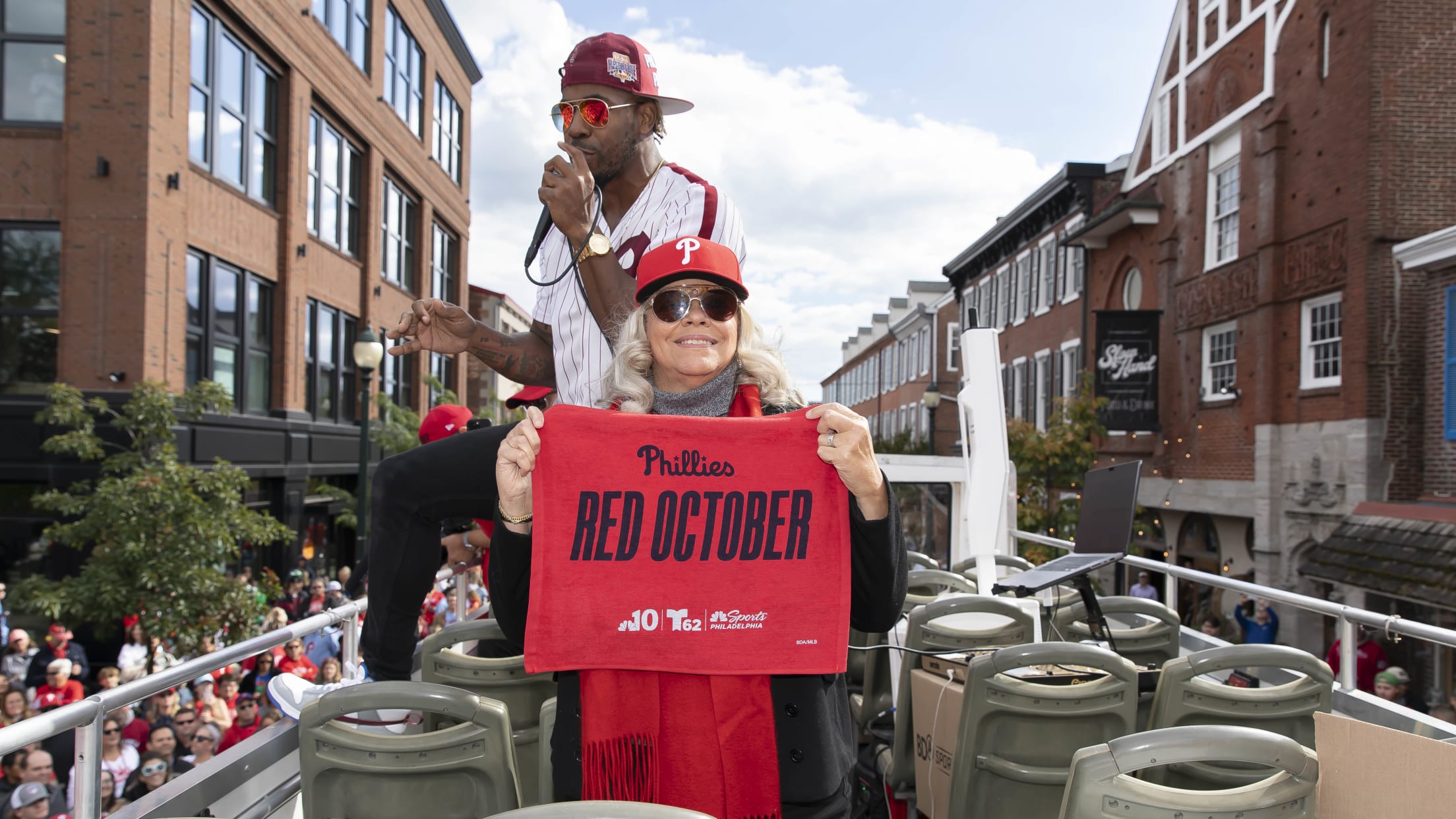 Phillies fans celebrate during Rally for Red October bus tour