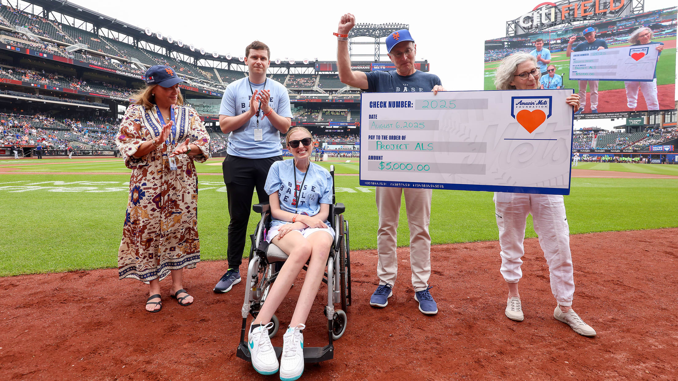Sarah Langs is honored on the field before the Mets game