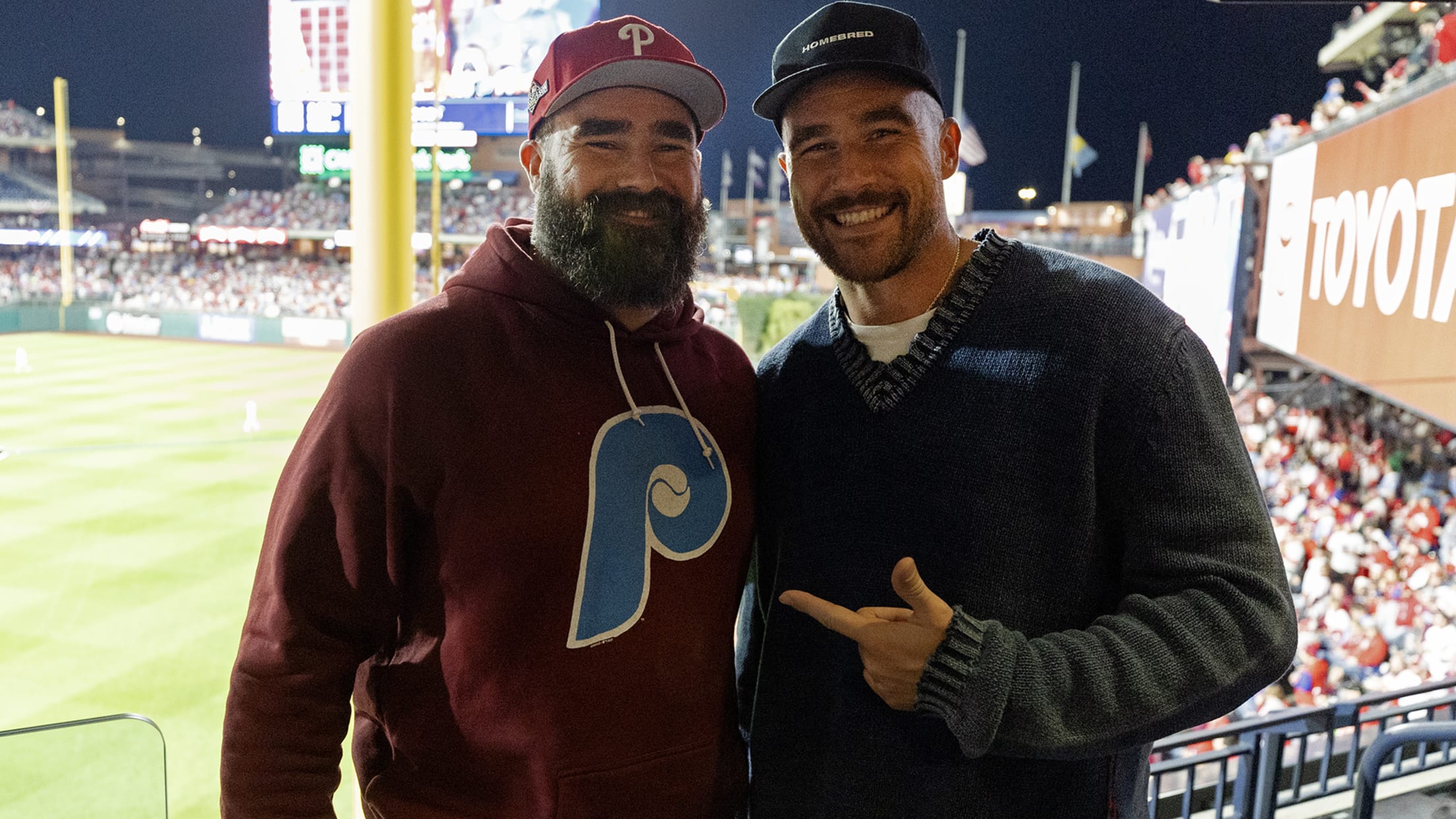 Jason and Travis Kelce at the ballpark