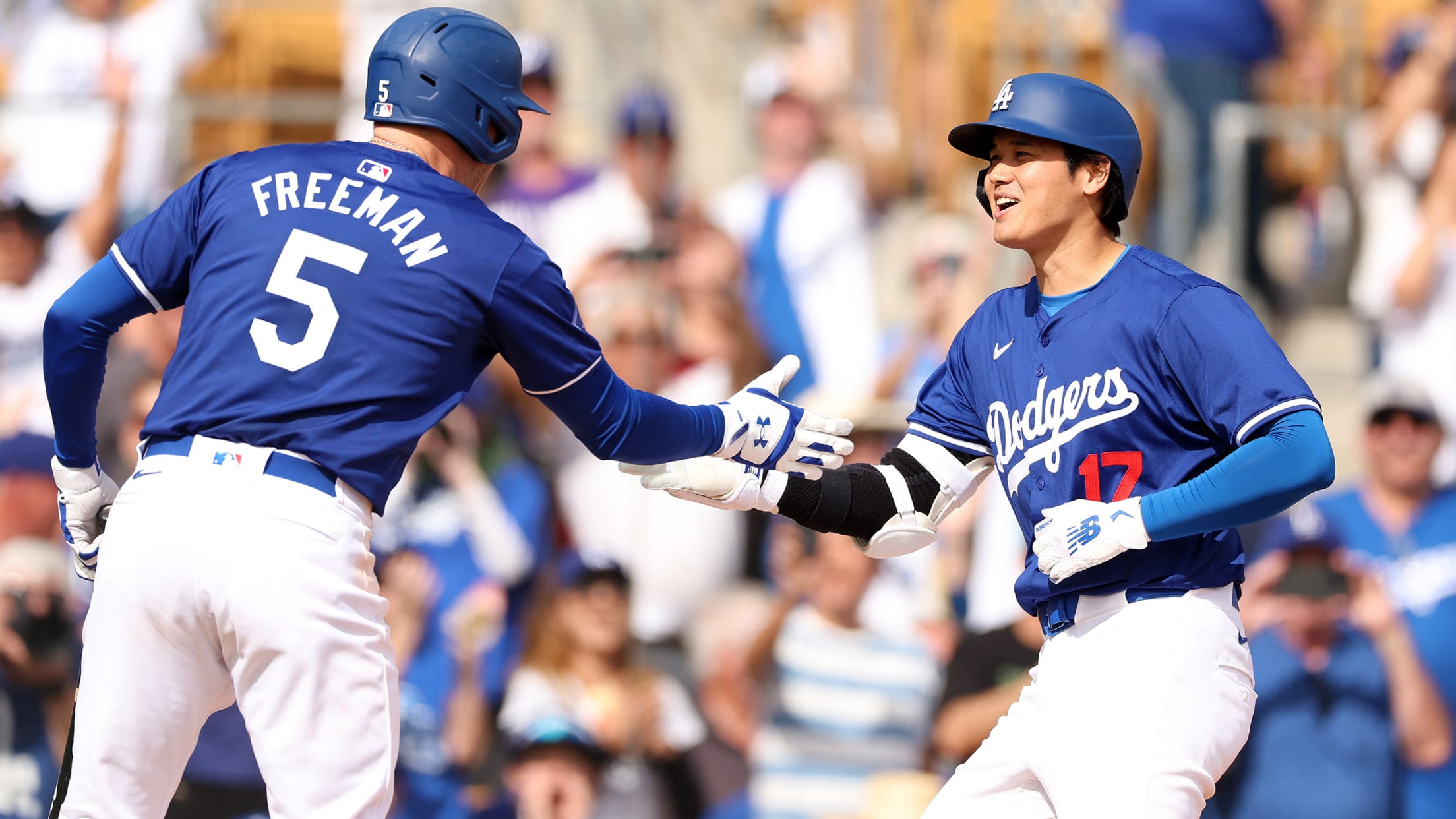 Freddie Freeman greets Shohei Ohtani after his homer