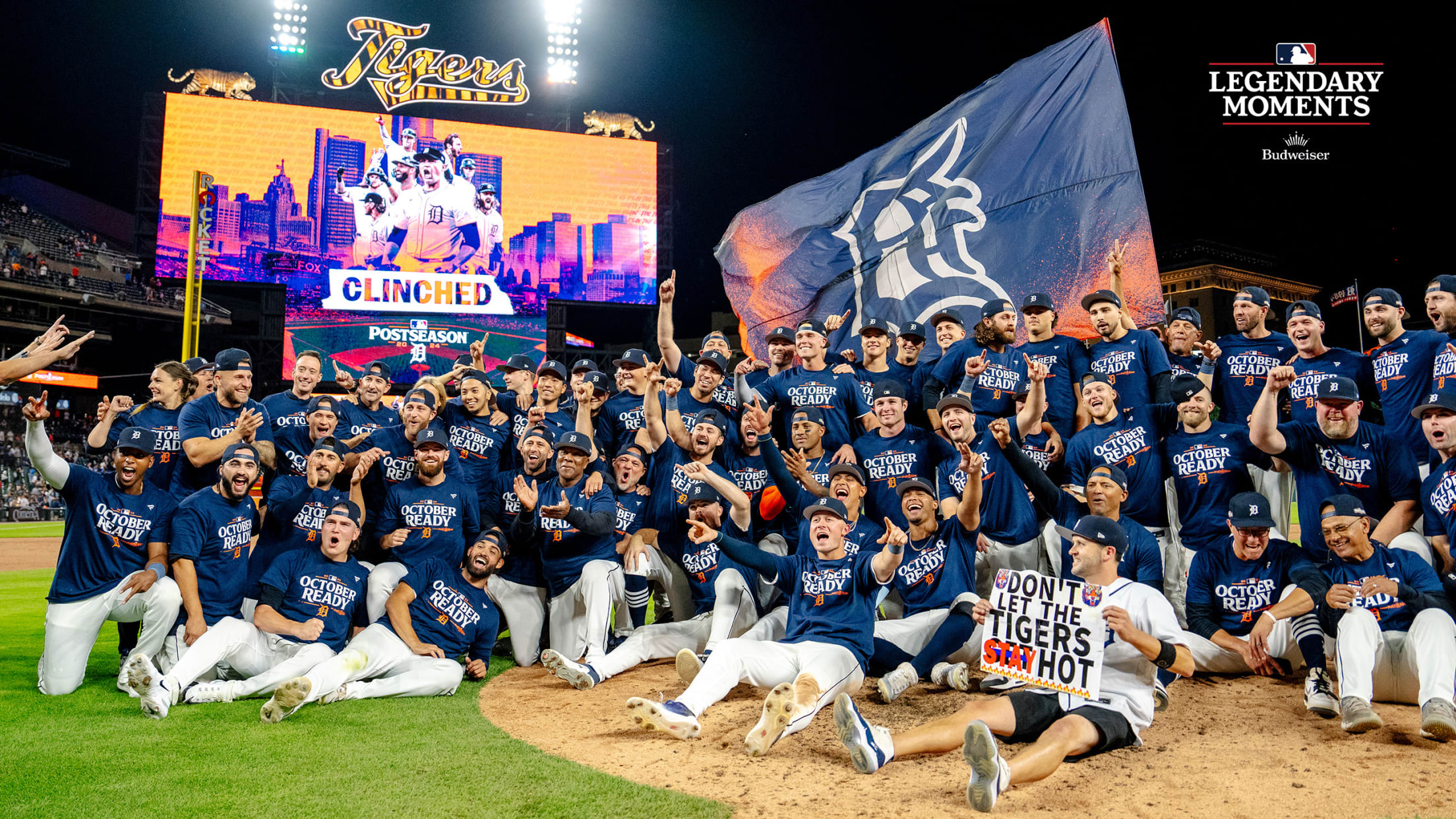 The Tigers gather for a photo on the mound after clinching a playoff berth