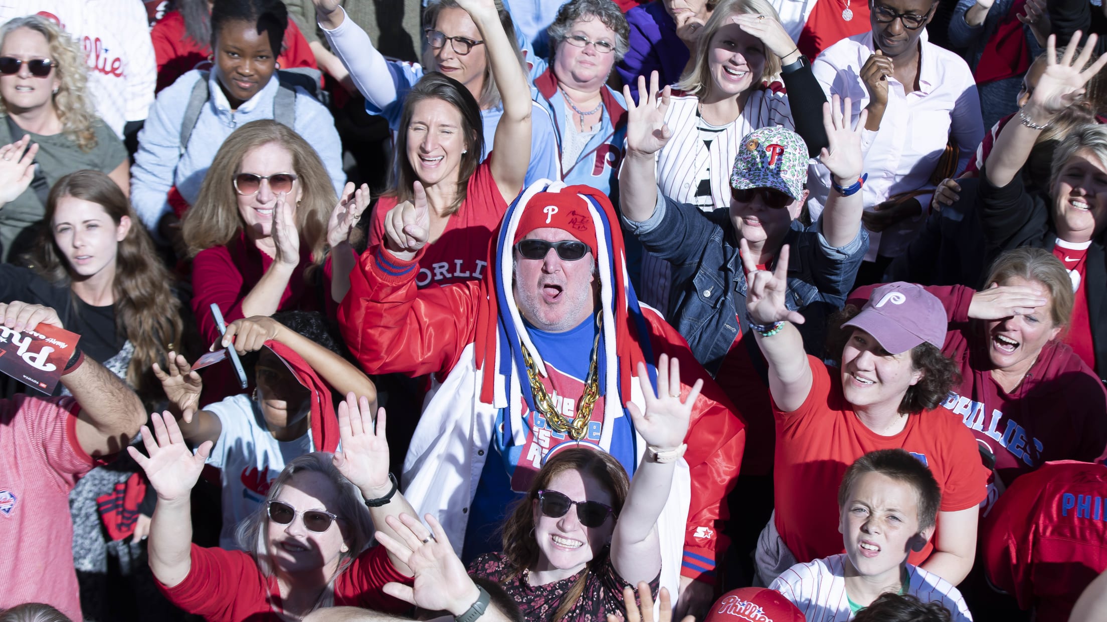 Phillies fans celebrate during Rally for Red October bus tour