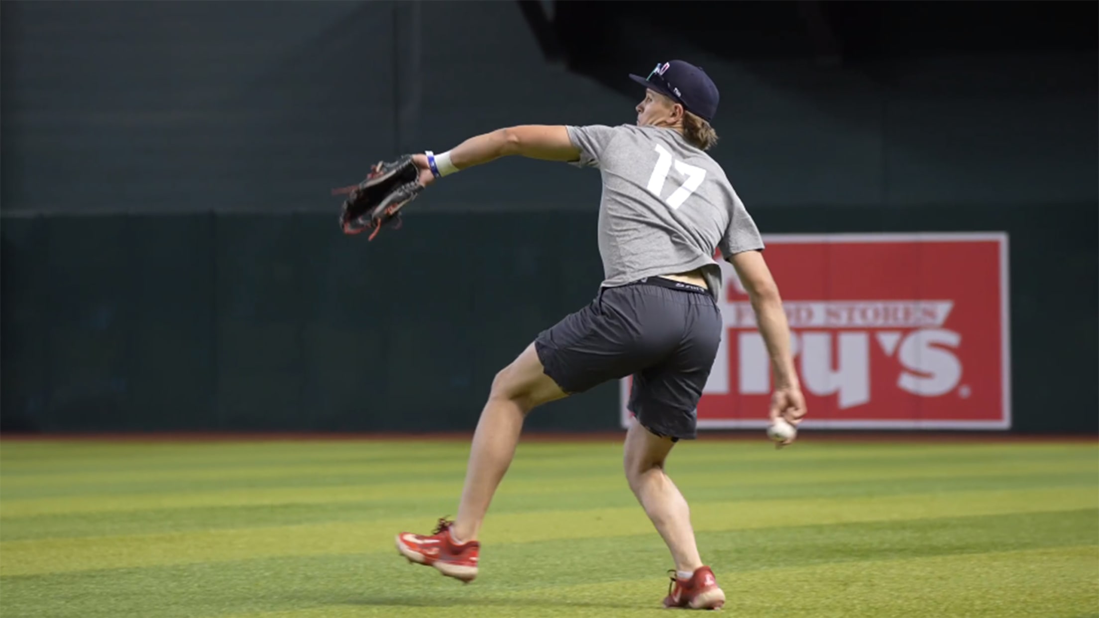 Cole Carrigg winds up to throw from the outfield