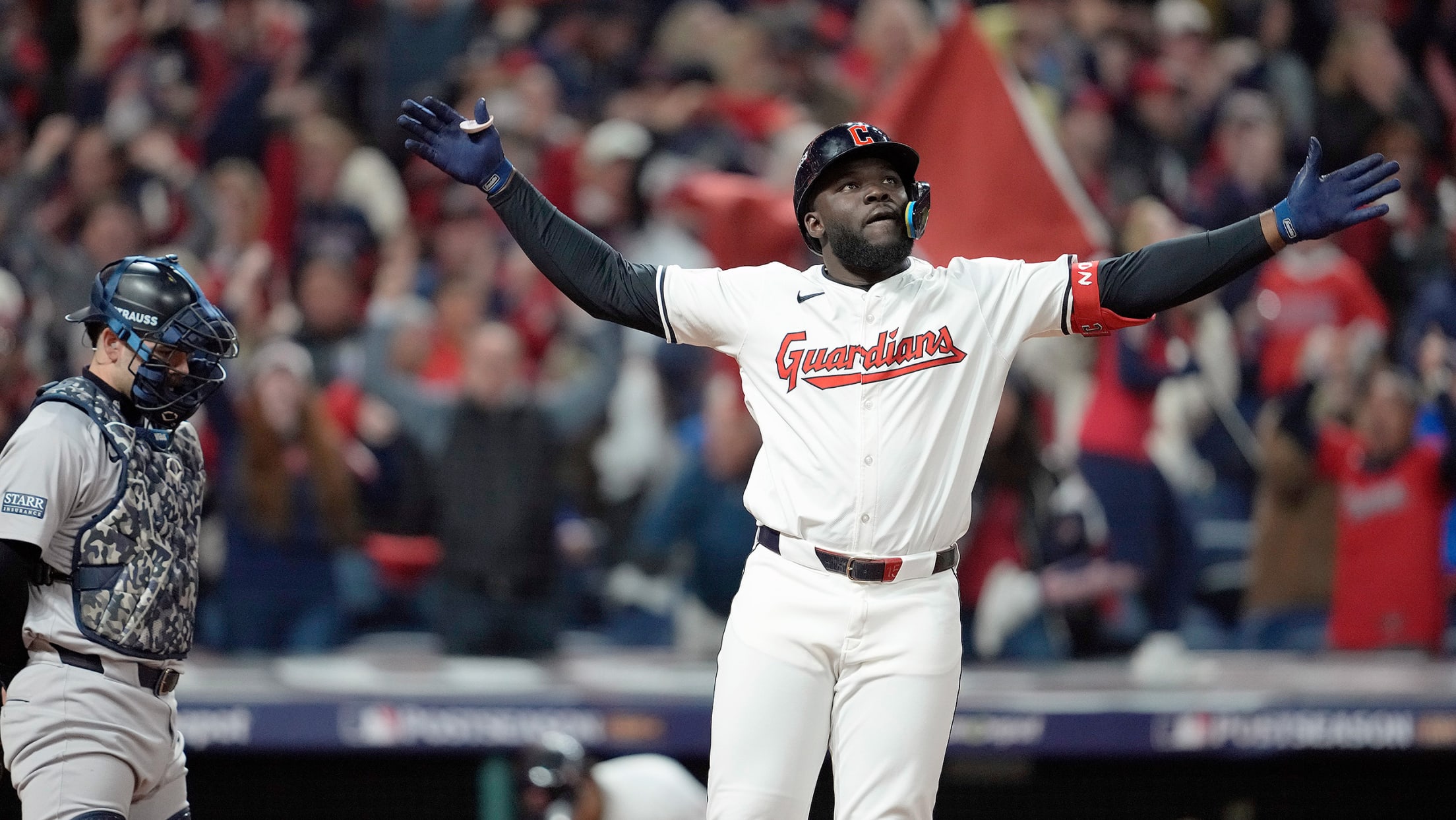 Jhonkensy Noel leaps as his game-tying home run soars toward the seats