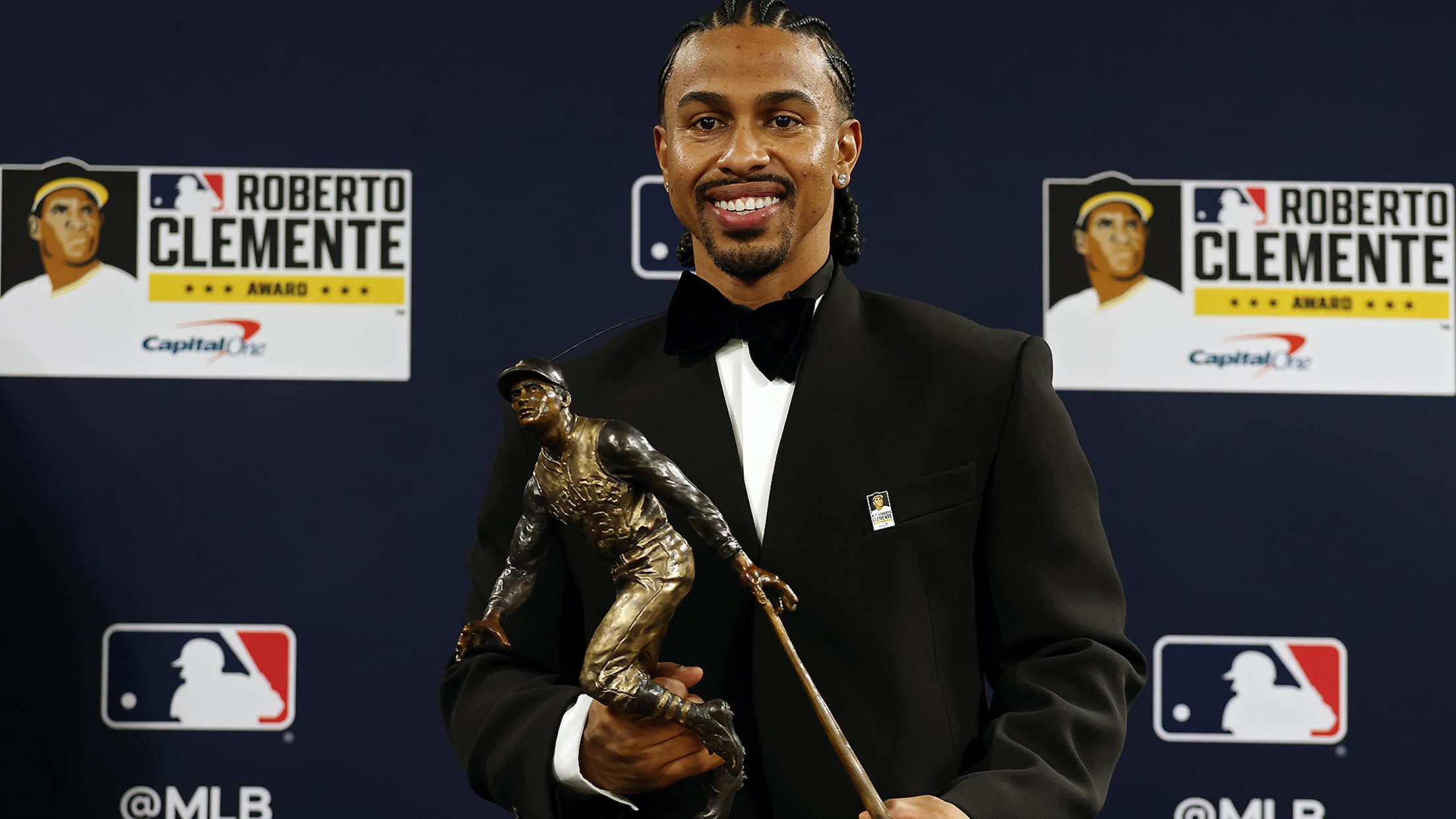 Francisco Lindor holding the Roberto Clemente Award