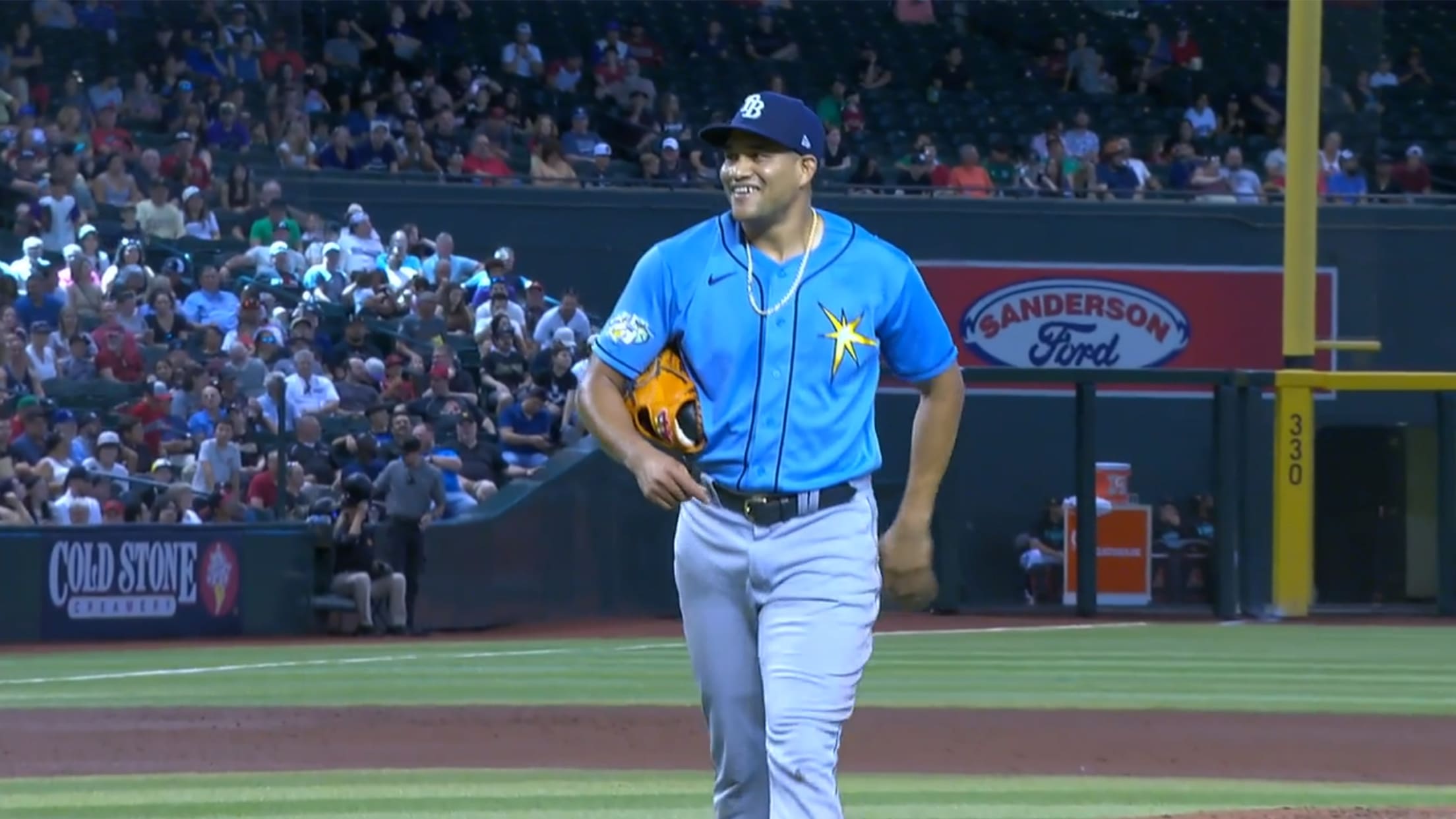 Yonny Chirino walks off the mound smiling