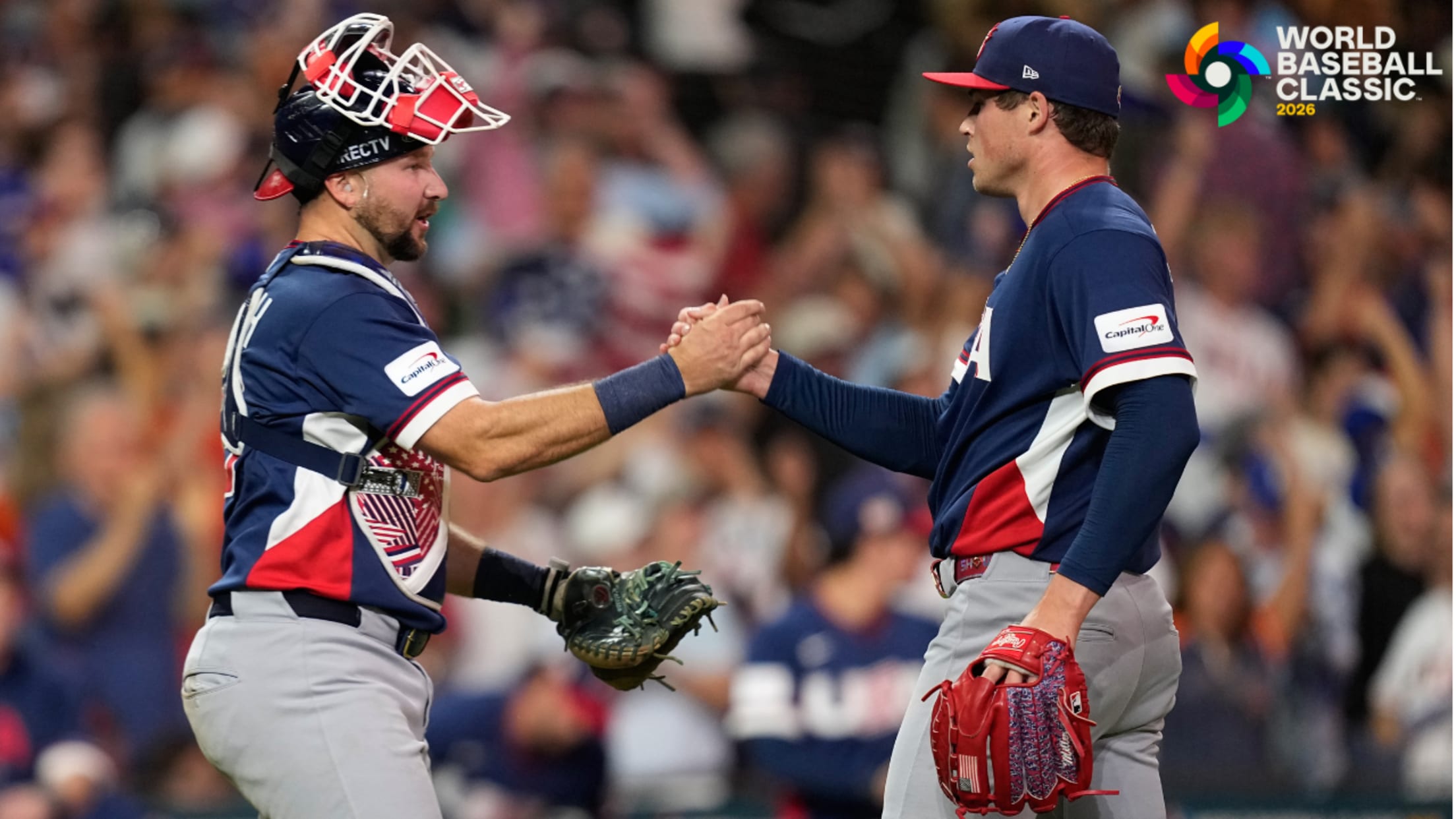 Catcher Cal Raleigh and pitcher Mason Miller shake hands