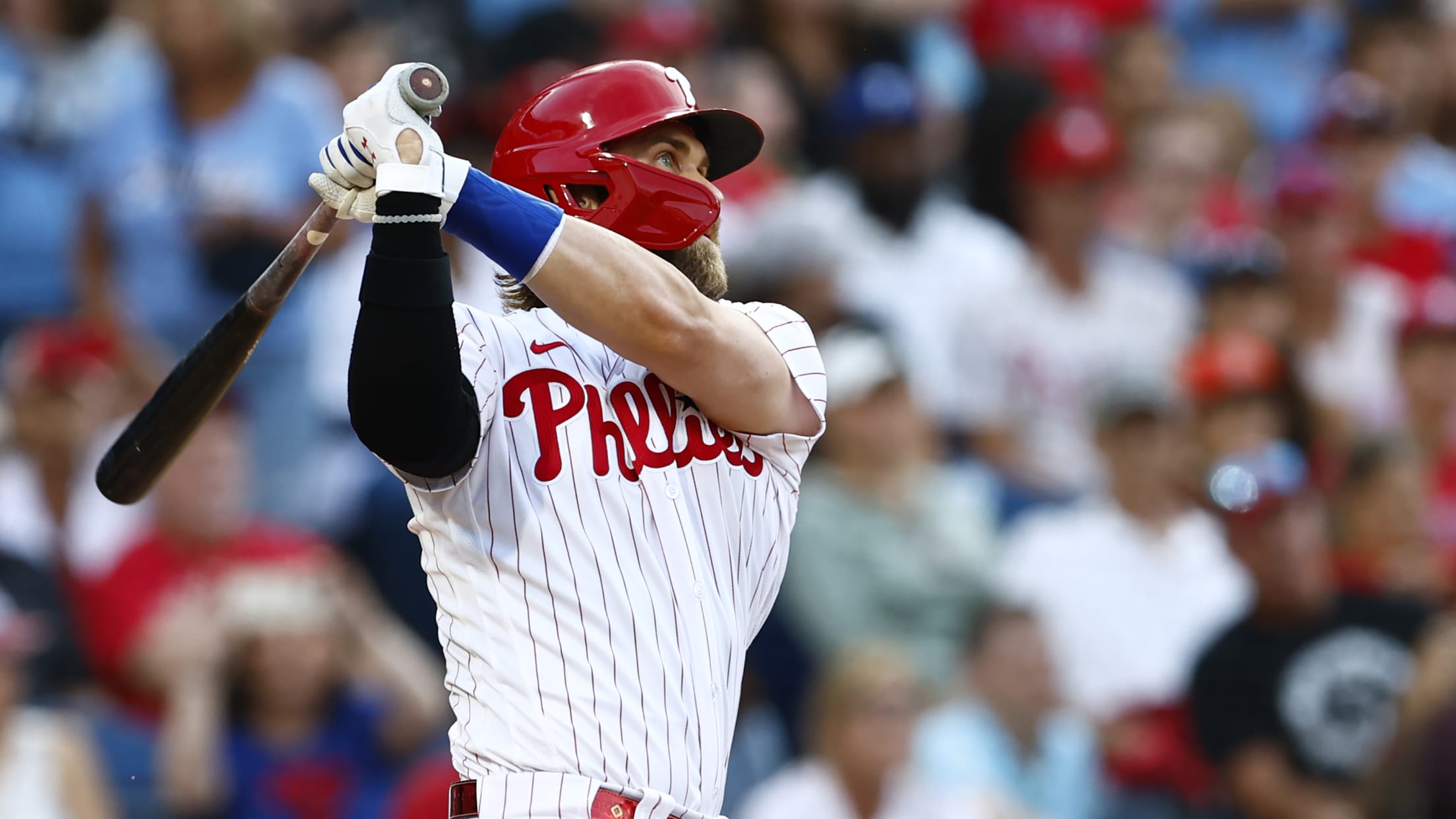 Bryce Harper follows through on a swing