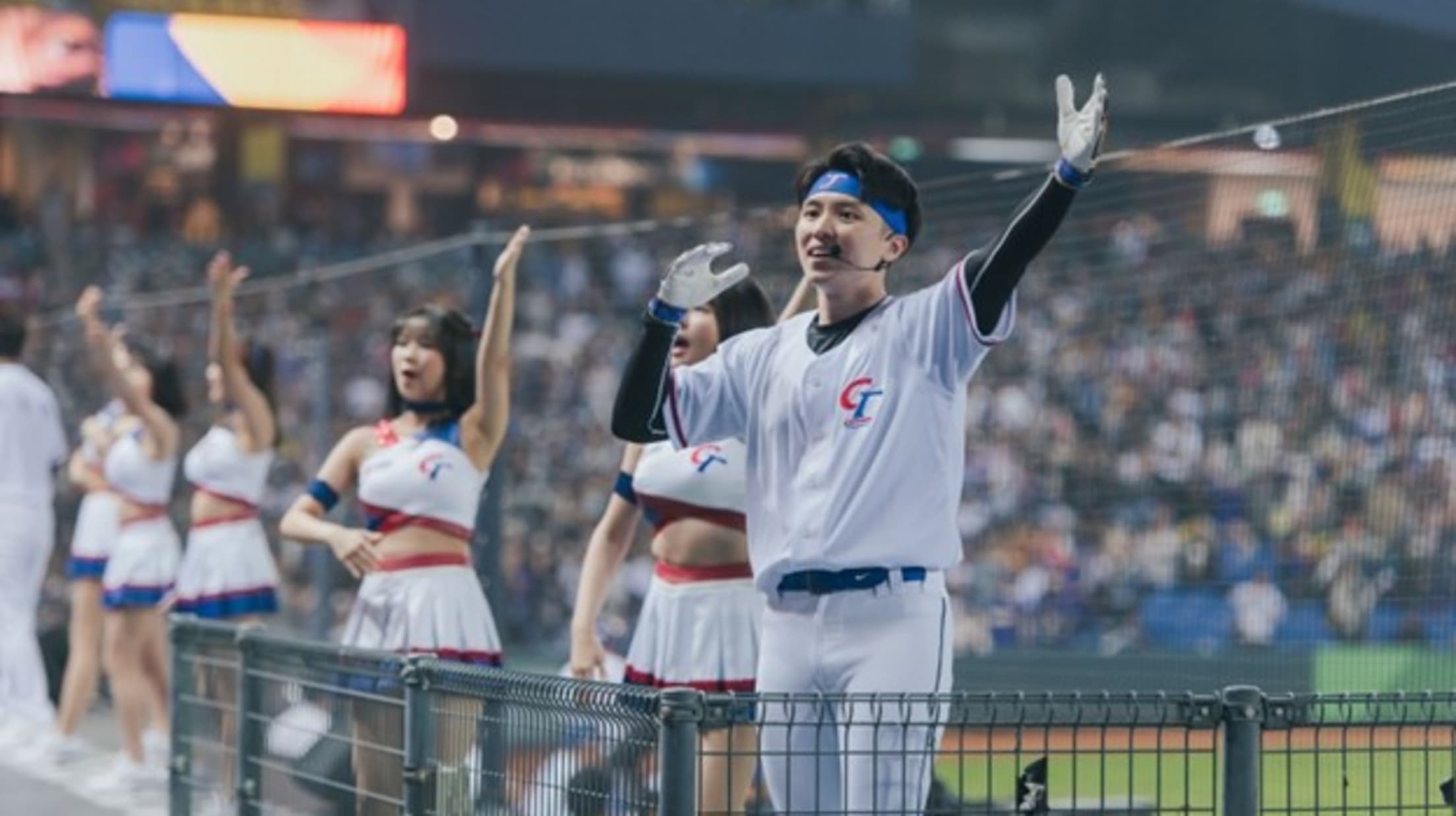 Cheerleaders line the top of the Chinese Taipei dugout