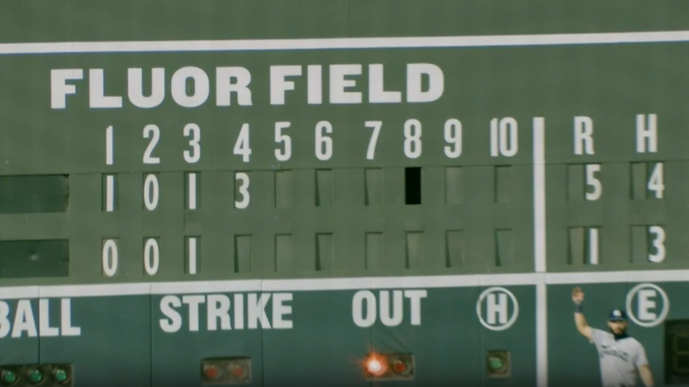 Greenville's Fluor Field scoreboard, a copy of Boston's Green Monster, shown with a panel missing for the top of the 8th