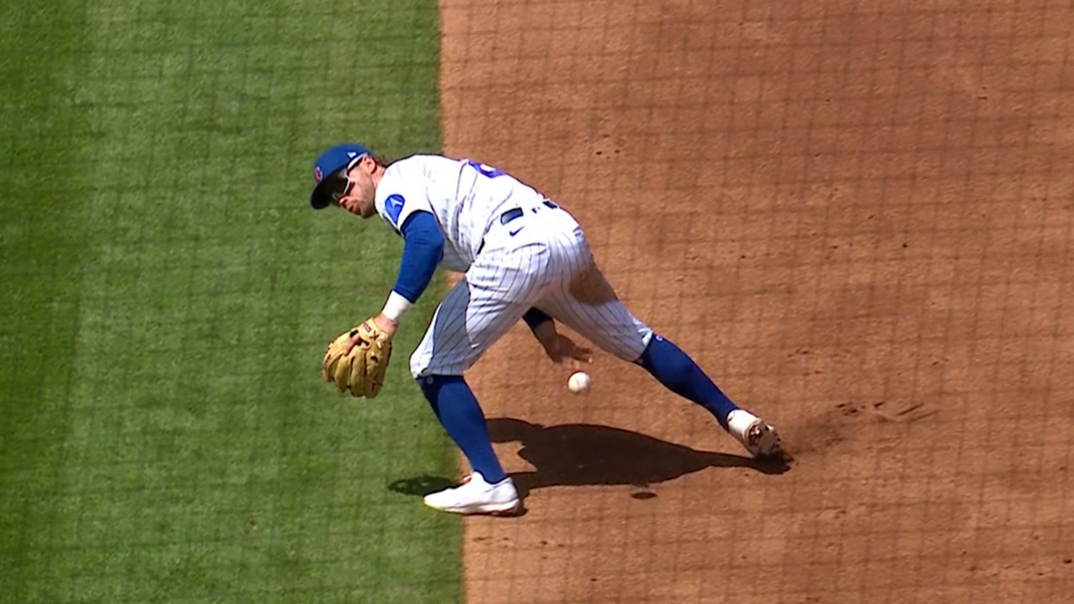 Nico Hoerner throws between his legs for the out