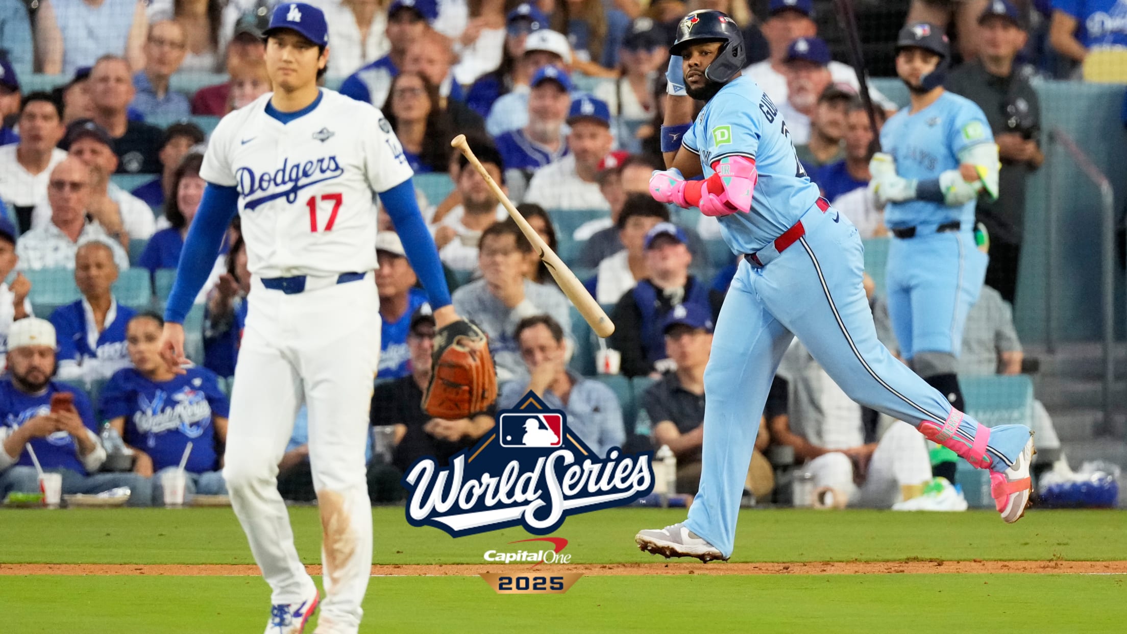 Vladimir Guerrero Jr. tosses his bat as he and Shohei Ohtani watch his home run