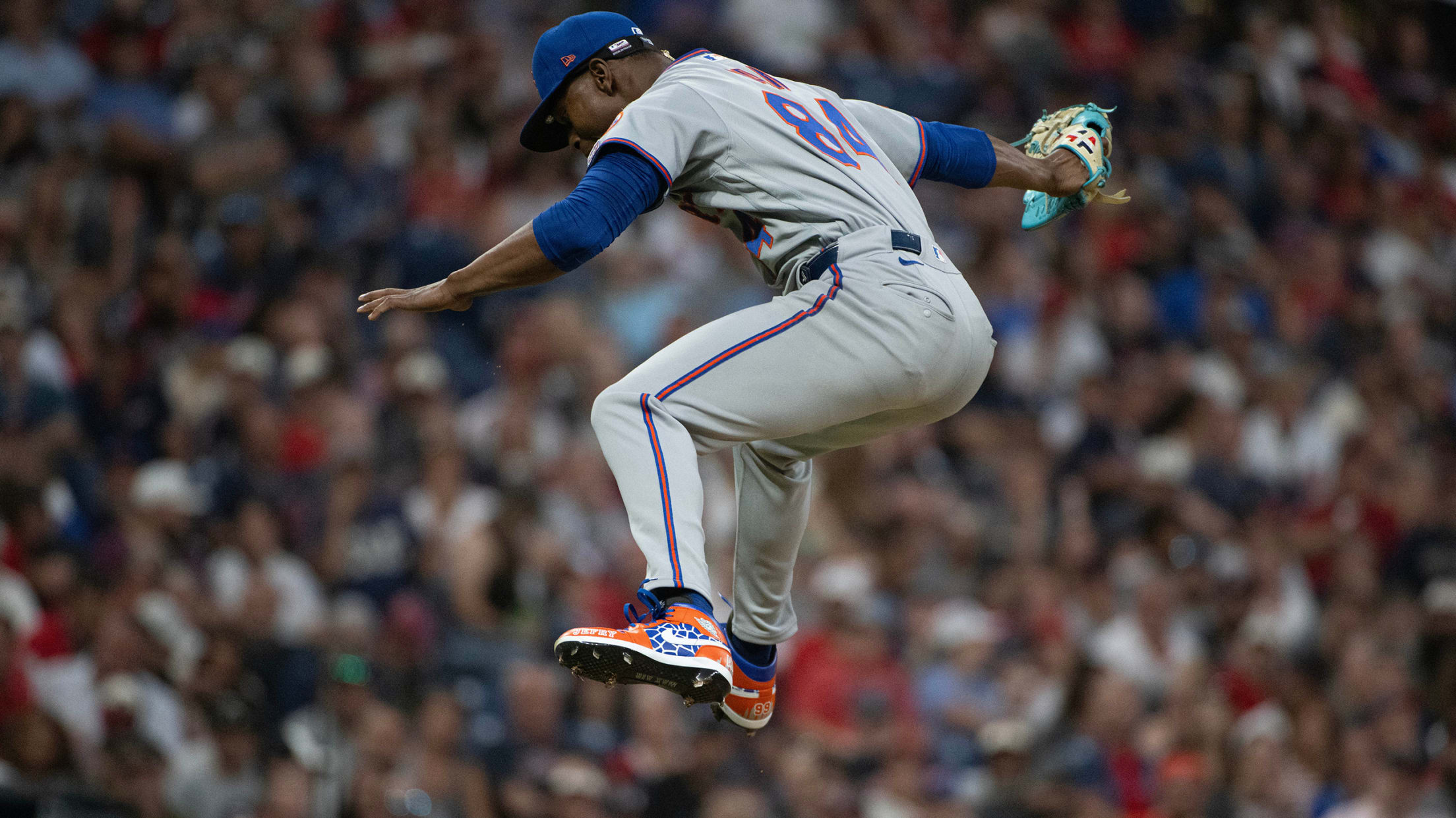 Jefry Yan leaps into the air after a strikeout