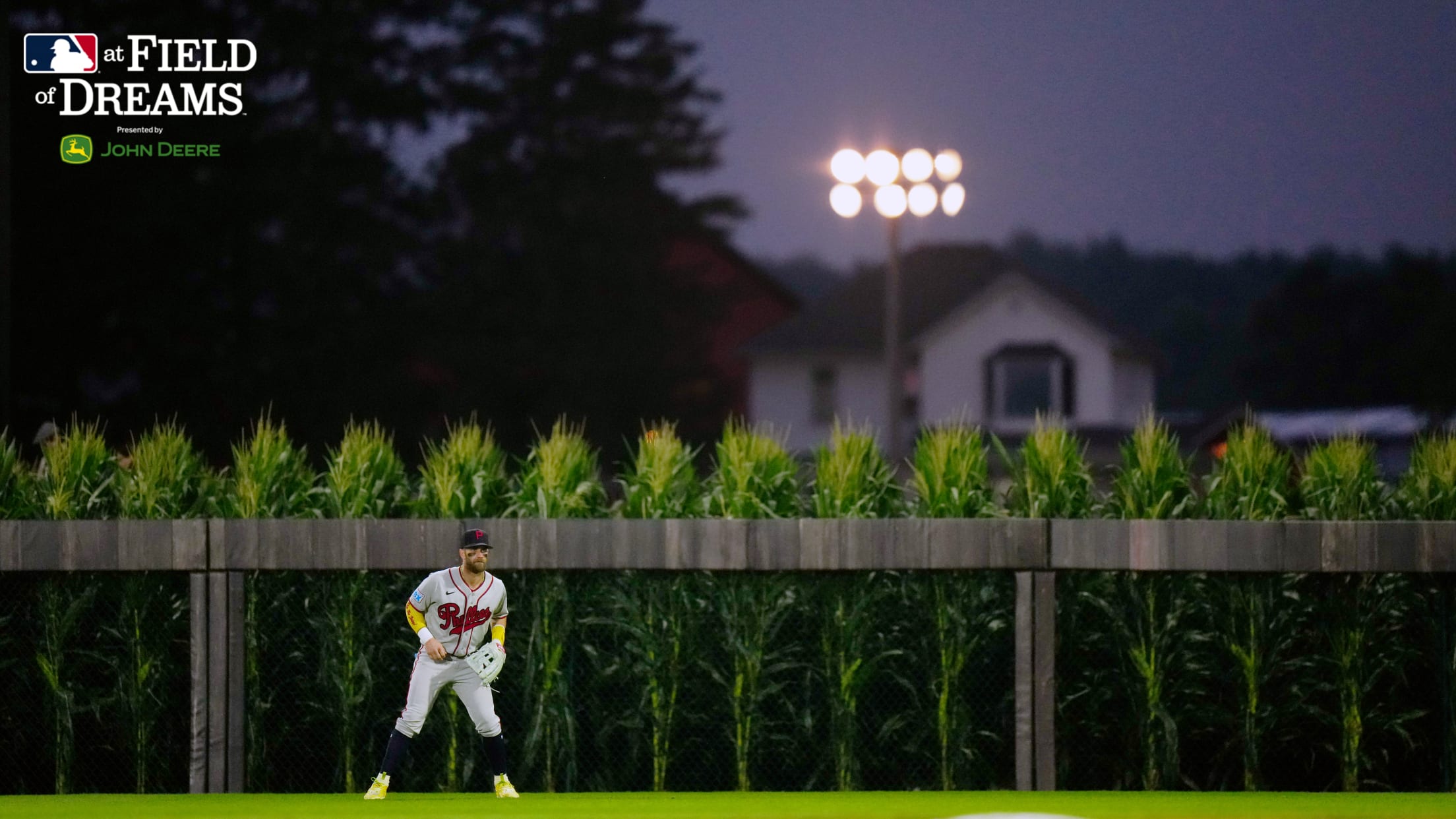 Bryce Harper mans right field in front of the corn, with the farmhouse in the distance