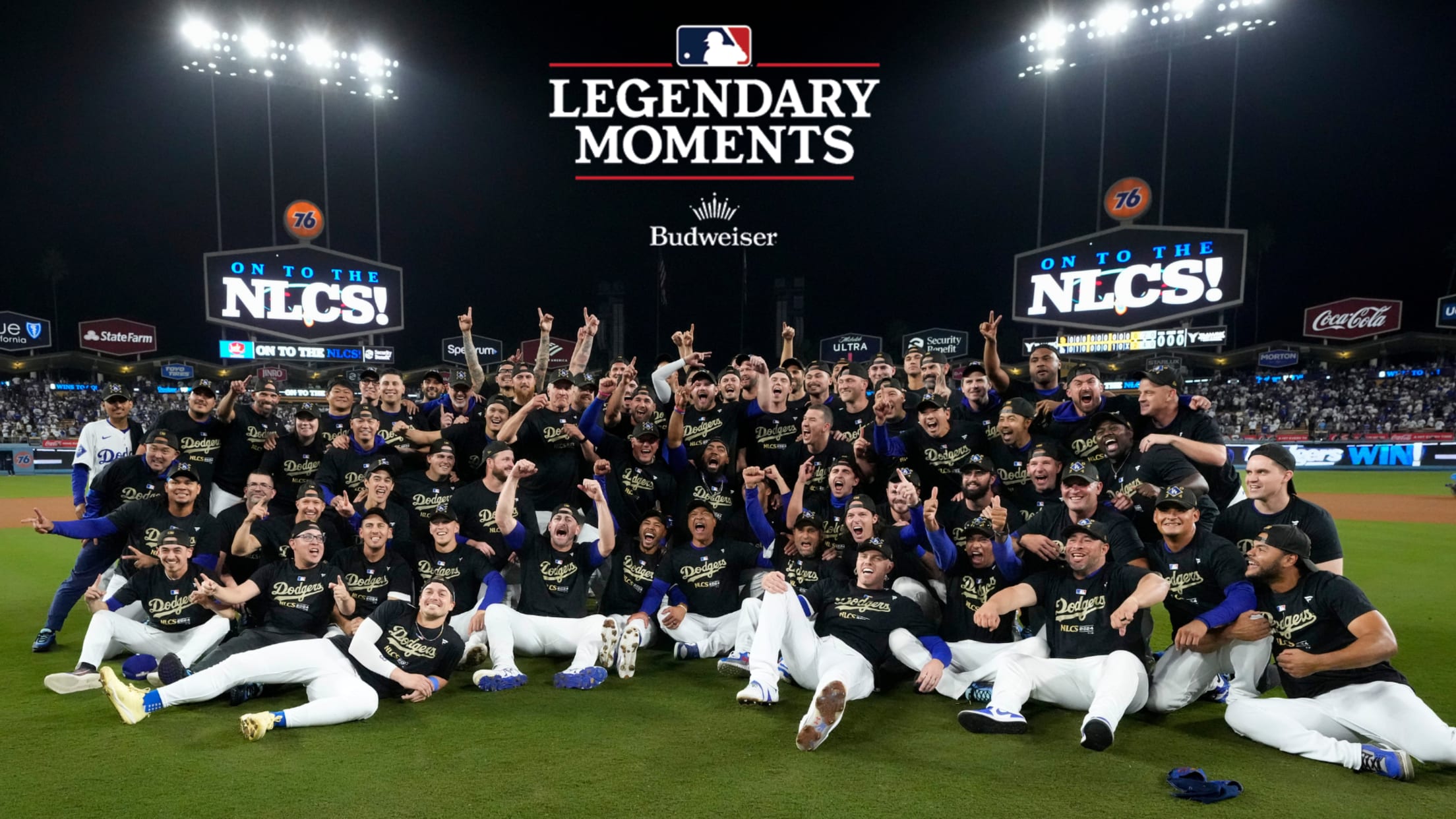 The Dodgers gather for a team photo on the field after advancing to the NLCS