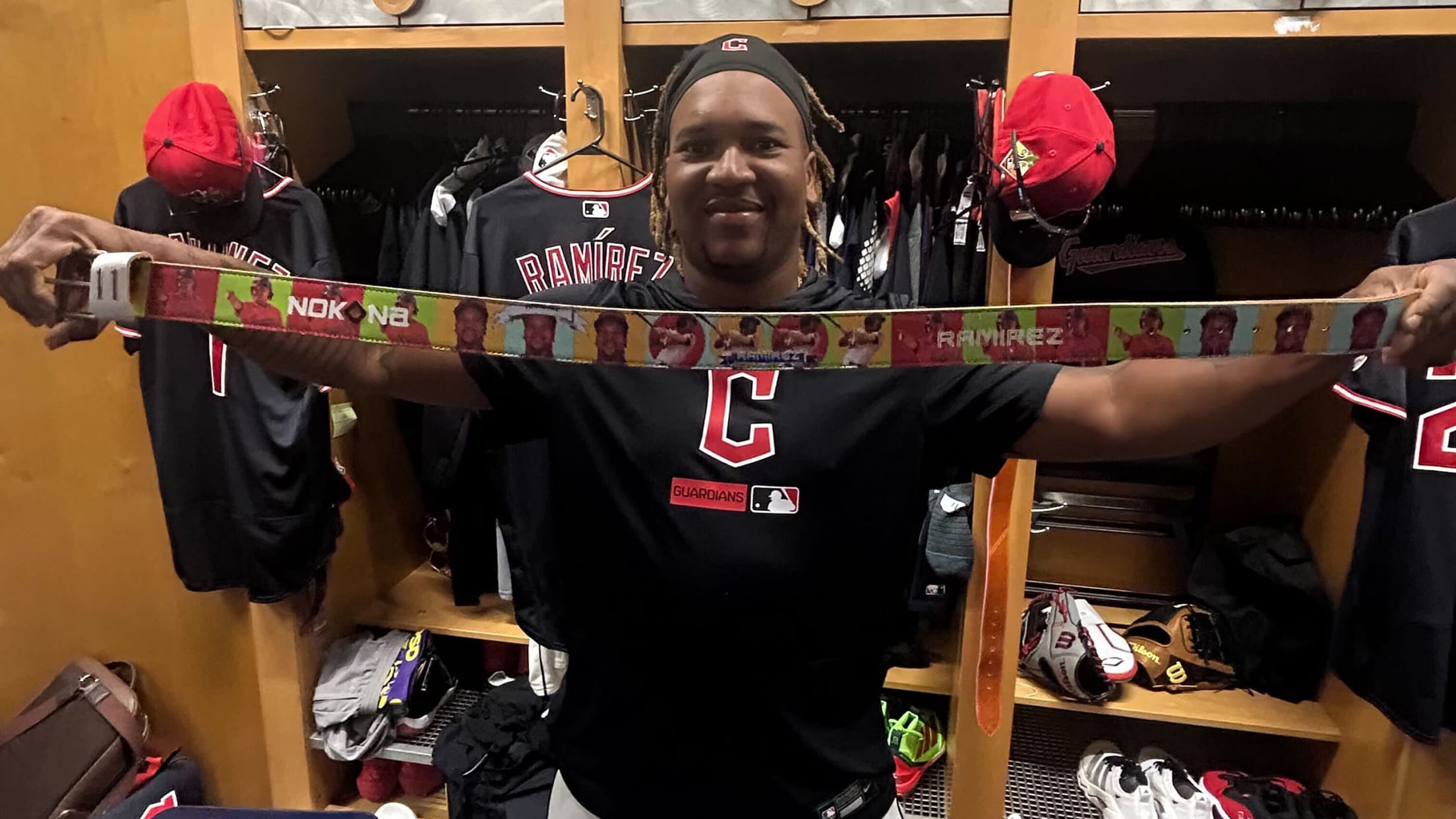 José Ramírez holds up a custom belt with his image on it