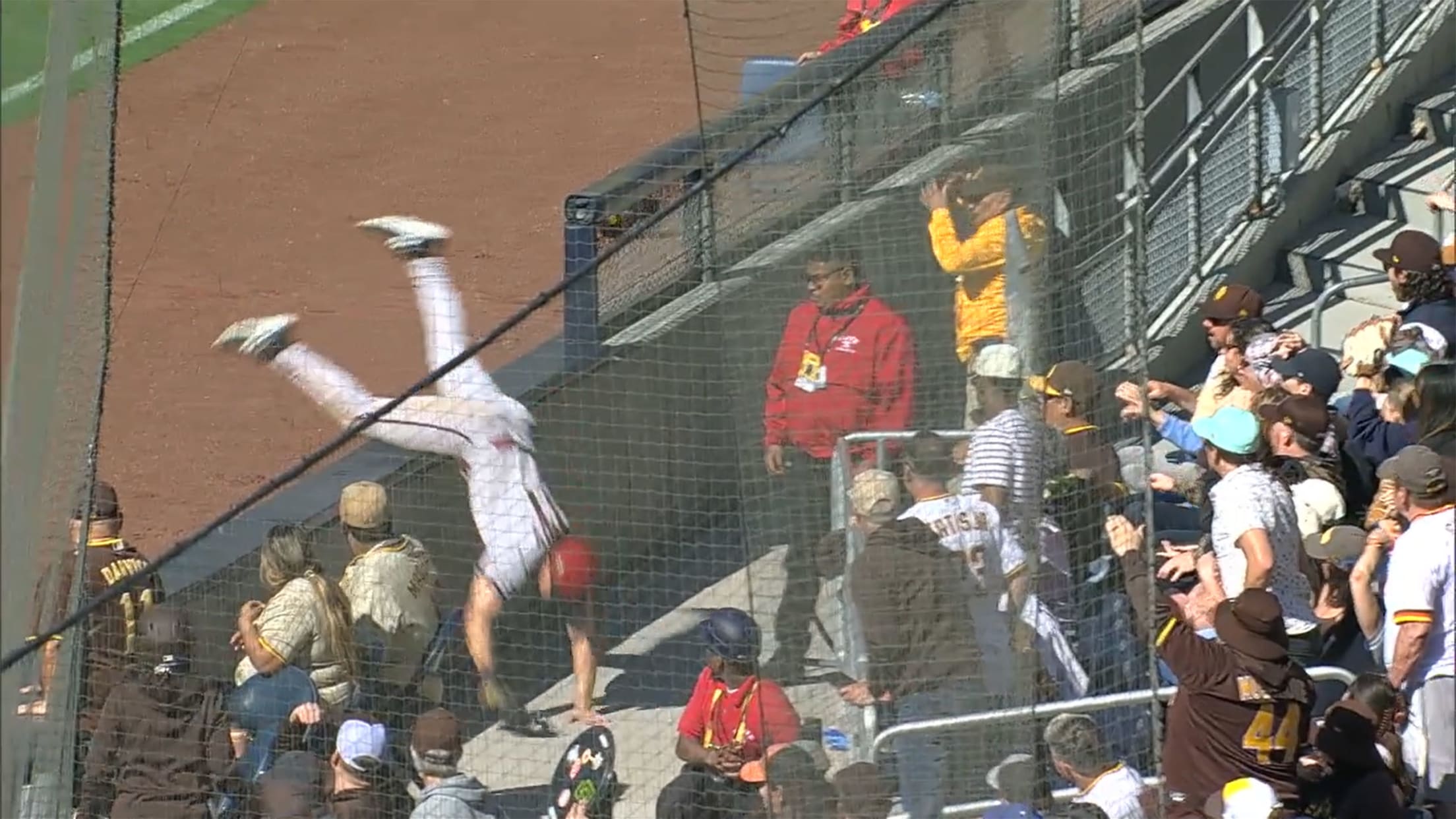 A screengrab of Jake McCarthy tumbling over a low wall