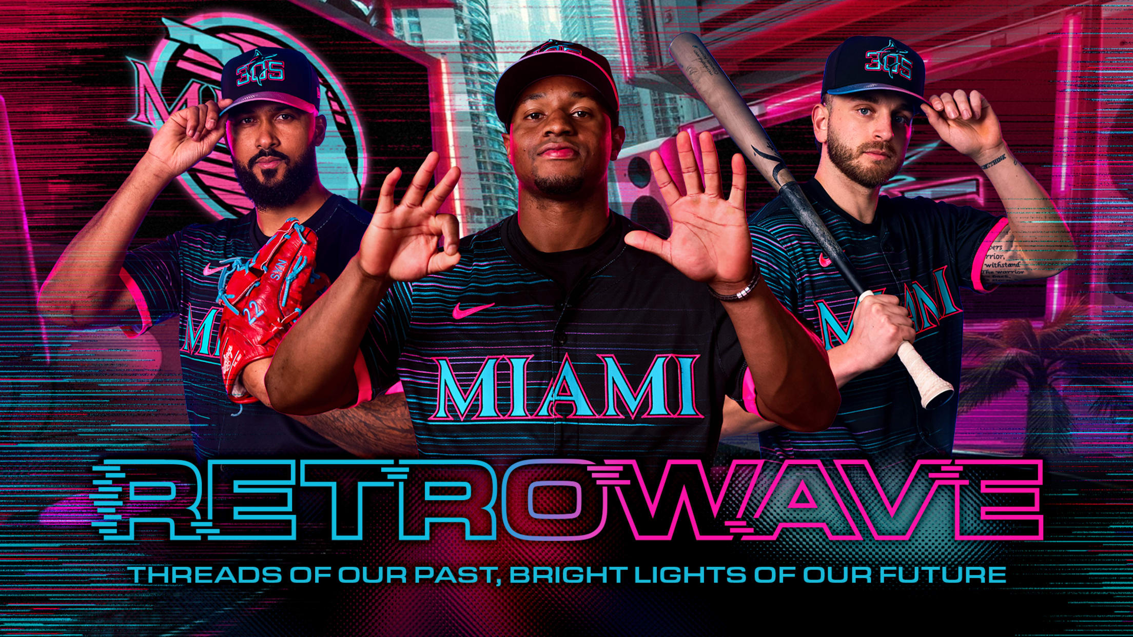 Three Marlins players model the team's new black cap and jersey featuring teal and pink lettering and accents