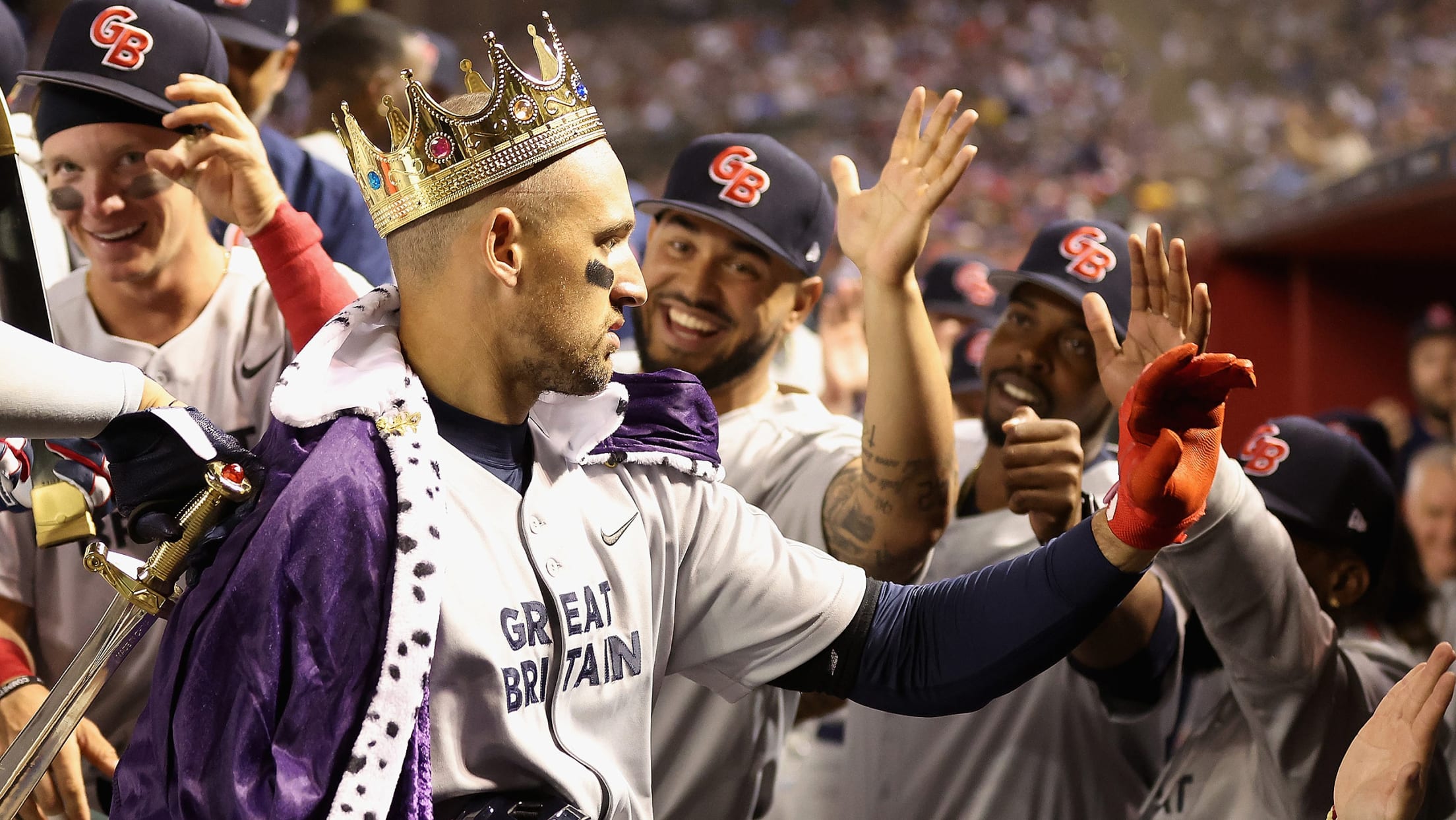 Trayce Thompson wears a crown in the Great Britain dugout