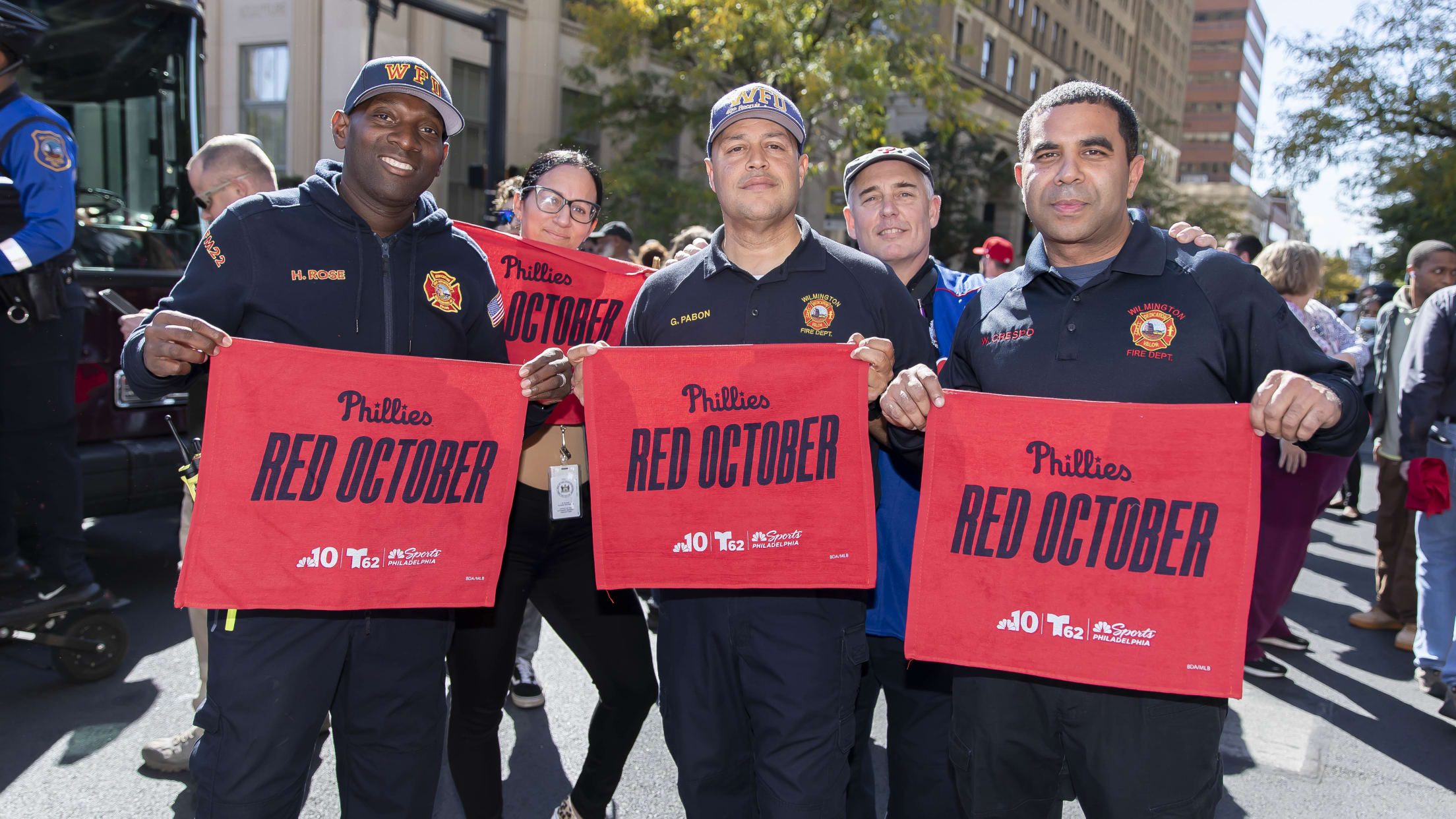 Phillies fans celebrate during Rally for Red October bus tour