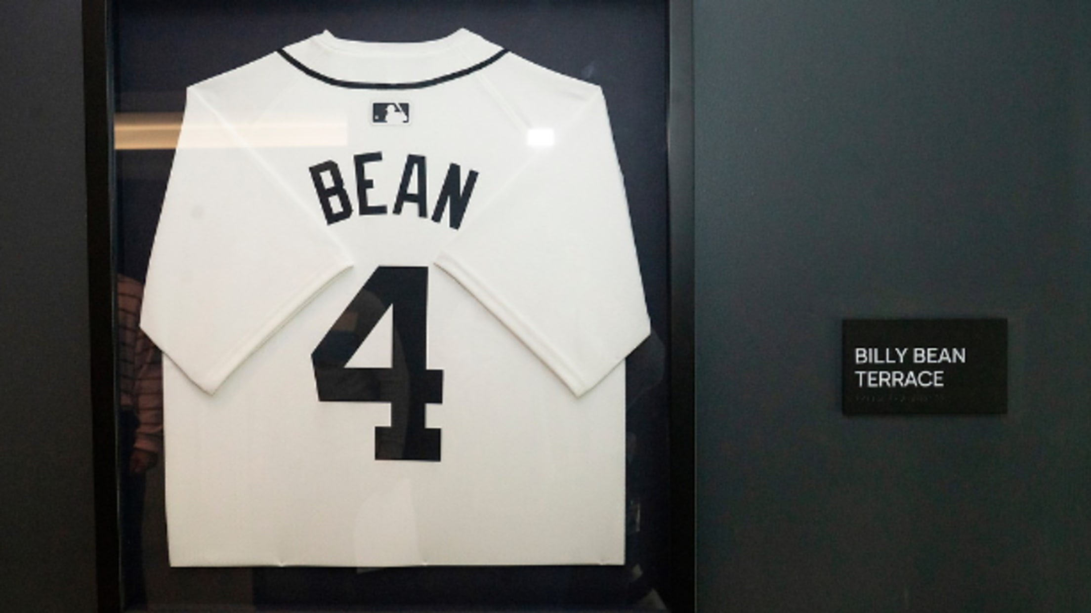 A framed Billy Bean jersey hangs outside the entrance to the Billy Bean Terrace at MLB headquarters