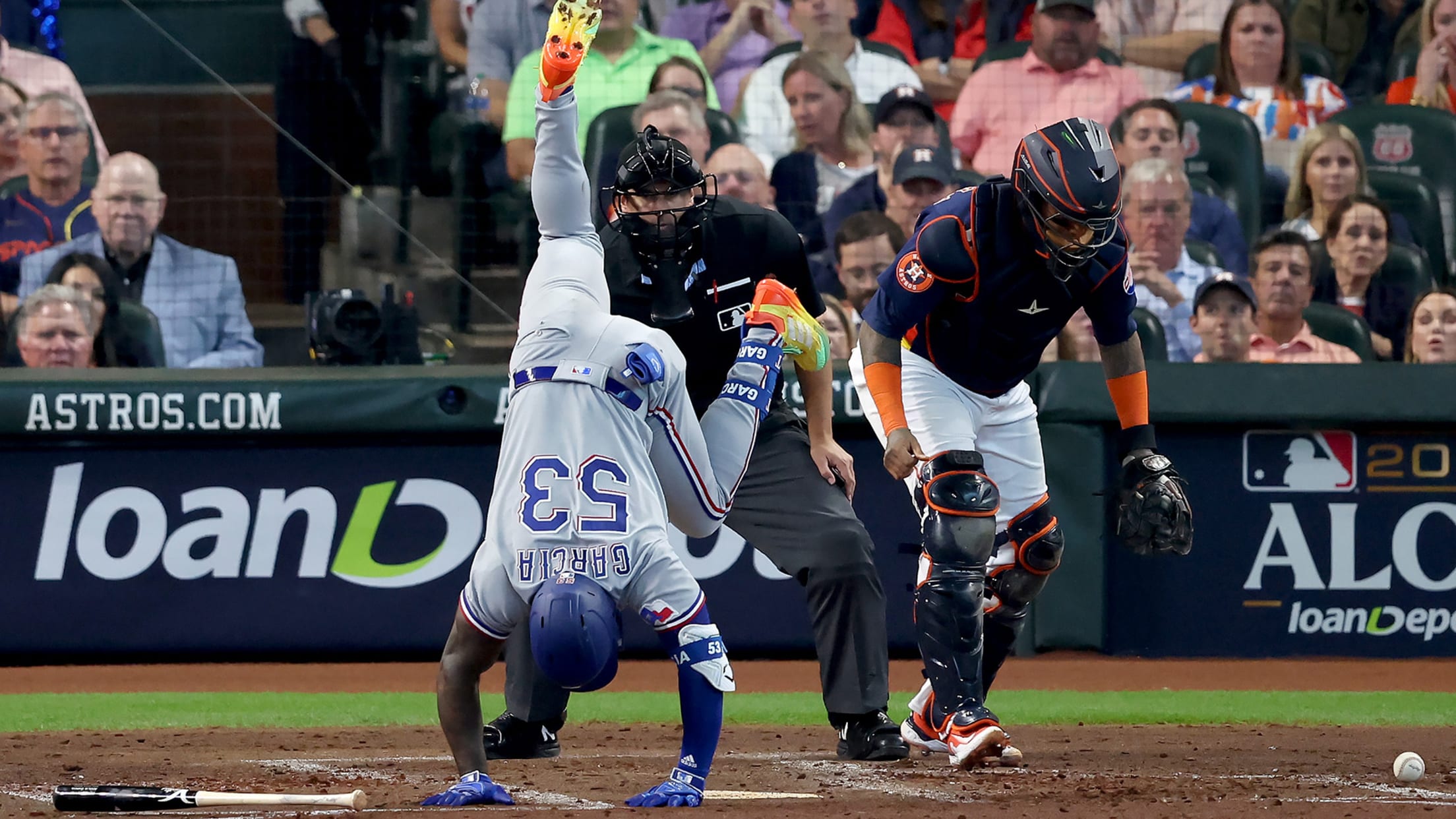 Adolis García cartwheels across home plate