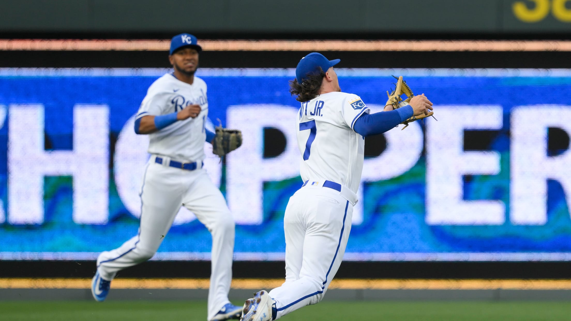 Bobby Witt Jr. dives with his back to the infield to make a catch