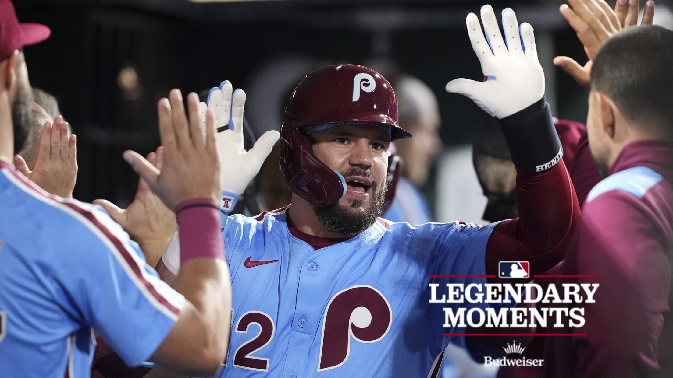 Kyle Schwarber gets high-fives in the dugout