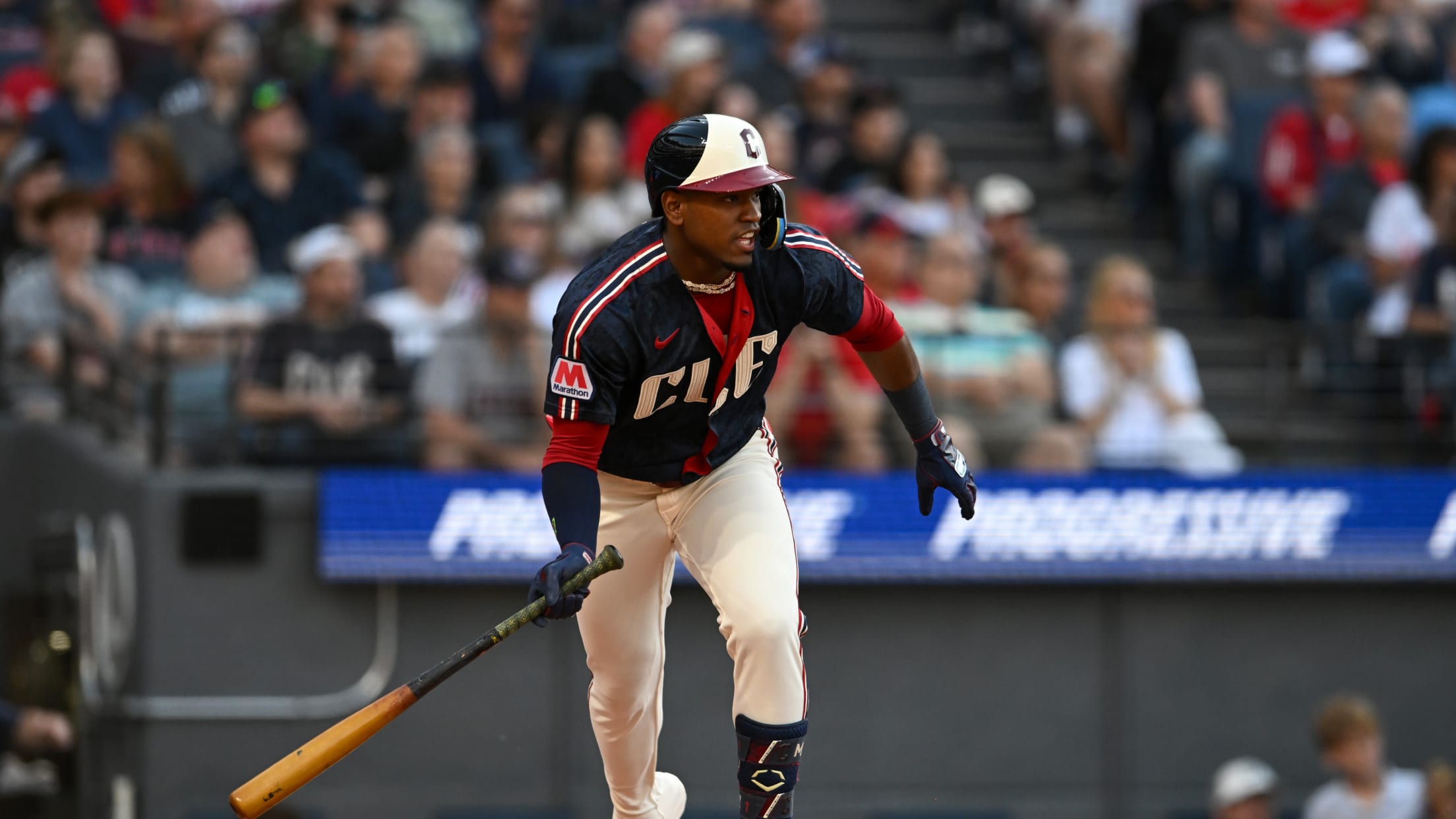 Two runs score on Angel Martínez's single