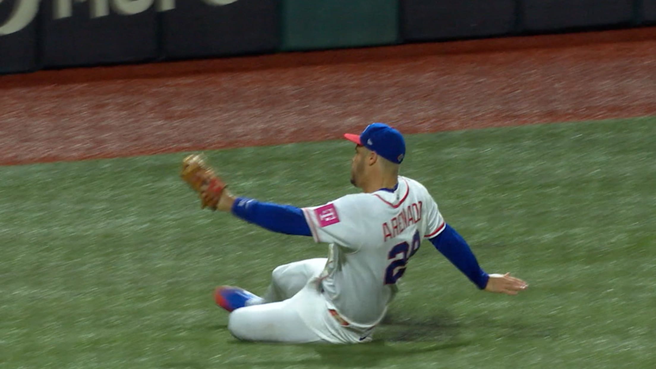 Nolan Arenado slides to make the great catch