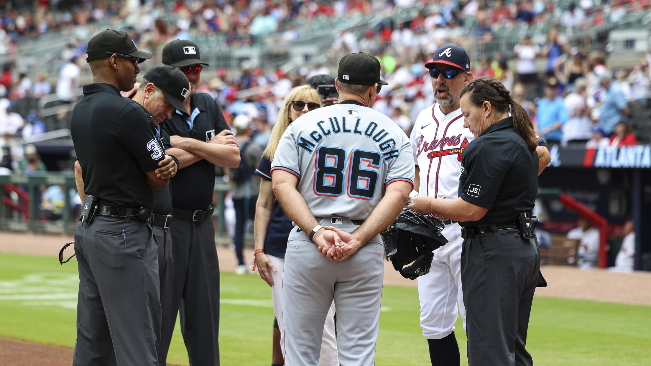 Marlins manager Clayton McCullough and Braves manager Walt Weiss at home plate before a game