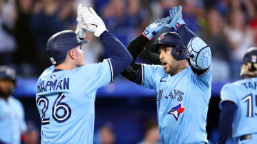 Toronto Blue Jays third baseman Matt Chapman high-fives left