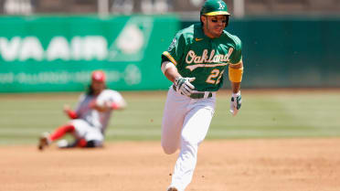 Oakland Athletics' Ramon Laureano, left, is tagged out by Houston