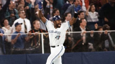 Toronto Blue Jays' Rickey Henderson celebrates after scoring the winning  run on a Devon White triple in Game 4 of the World Series against the  Philadelphia Phillies on Oct. 20, 1993, in