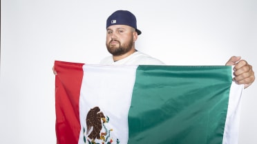 Rowdy Tellez of Team Mexico puts on a sombrero after hitting a