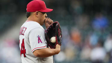 Los Angeles Angels' Brett Phillips, right, gives Luis Rengifo (2) a helmet  after Rengifo hit a home run during the fifth inning of a baseball game  against the Toronto Blue Jays in