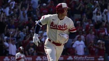 Los Angeles Angels' Shohei Ohtani flips his hair as he fixes his helmet  during his at-bat in the first inning of a baseball game against the  Toronto Blue Jays in Toronto, Sunday