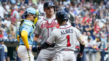 Atlanta Braves' Ozzie Albies (1) gets a hug from Orlando Arcia after hitting  a two-run home run in the fourth inning of a baseball game against the  Cincinnati Reds Tuesday, April 11