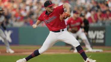 Shohei Ohtani of the Los Angeles Angels puts on pink cleats to celebrate  Mother's Day before a baseball game against the Cleveland Guardians at  Progressive Field in Cleveland, Ohio, on May 14