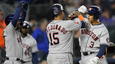 Jeremy Pena and Jose Altuve of the Houston Astros embrace after