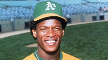 Rickey Henderson's mother, Bobbie Henderson, left, and his wife, Pamela,  laugh as a video introduction for Rickey Henderson is played at the  Baseball Hall of Fame in Cooperstown, N.Y., Sunday, July 26