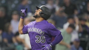 Here to help: Rockies catcher Elias Diaz extends a hand to his